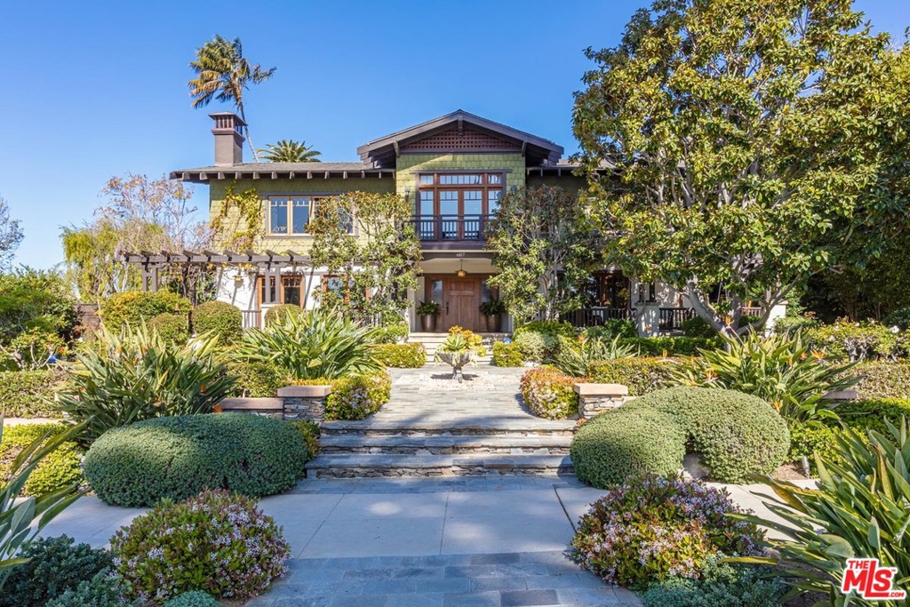Majestic early California Craftsman jewel on over 34,000 square feet (per ass.) of sprawling grounds on historic Georgina Ave, just a block from picturesque Ocean Ave. Painstakingly restored & remodeled with wonderful taste, quality, and sensitivity to the original architecture. All the signature elements of the much sought-after Craftsman style can be found throughout: low pitched gable roofs, wood floors, extensive wood detailing, beautiful built-ins, period tiles, bead board, paneling and wrap around windows. A welcoming front porch leads to a generous entry, formal living room with fireplace and large scaled formal dining room, each with French doors. Opening to the expansive rear yard is a cook's kitchen with breakfast area & large family room with fireplace. There are 4 bedrooms in the main house, including a spacious primary suite with sitting area, FP, terrace, beautiful bath & two furniture grade walk-ins, plus a detached gst hse with bath. Other spaces include an upstairs office/den plus a detached gym. Surrounded by patios, lawn, mature trees gorgeous landscaping & pool/spa, this one-of-a-kind property with unparalleled warmth, character & charm affords the very best Southern California lifestyle. Note: Consists of 2 legal lots, 601 Georgina (11,338 SF) & 607 Georgina (22,788 SF).