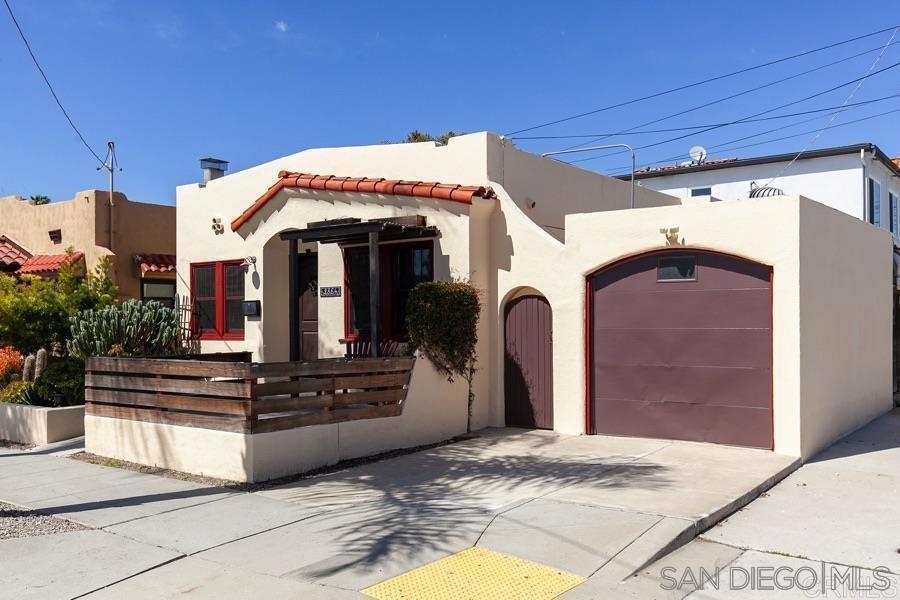 Nestled on the border of University Heights and North Park, this Spanish-style gem perfectly blends historic charm with modern upgrades. Built in 1927, this 2-bedroom, 1.25-bathroom home offers a thoughtfully designed living space. Remodeled kitchen and bathrooms, inset ceiling and archways, a stunning fireplace surround with a remote-controlled insert for cozy nights in. The double-hung Milgard windows throughout, allow for abundant natural light, while the wood floors add a touch of timeless elegance. The new roof and solar panels enhance energy efficiency, and the tankless water heater ensures endless hot water. Step outside to a private covered back patio, perfect for morning coffee or evening gatherings. Plus, enjoy the convenience of an attached one-car garage. Located in one of San Diego’s most sought-after neighborhoods, you’re just minutes from trendy cafes, award-winning restaurants, vibrant nightlife, and lush parks. Don't miss your chance to own a piece of history with all the modern comforts you desire!