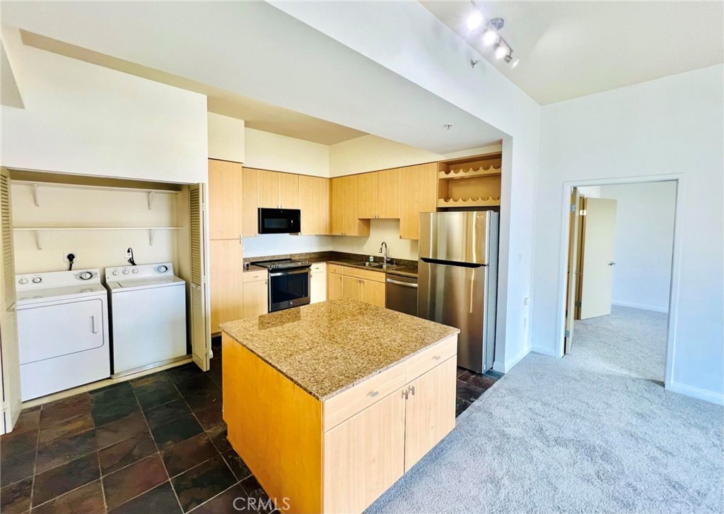 9TH FLOOR + 2 BED + 2 BATH + 3 BALCONIES + CORNER END LOCATION + VAULTED CEILINGS + 2 VEHICLE PARKING! Impressive corner unit. Brand New: Carpet, Appliances and Fixtures and just Painted! Towering and breathtaking views of the city. Amazing at day and night! Open Floor Plan! 3 private balconies; each bedroom and the living room has a balcony and both bedrooms have spacious walk-in closets. Upgraded carpet. Granite kitchen countertops and island. 11ft tall ceilings. Full size washer and dryer and custom lighting. 2 vehicle parking; both located in a gated underground garage. Included are internet, water, and trash. Take the elevator directly up to your 9th floor condo! Building offers 1st class amenities; 24hr concierge, guest parking, swimming pool, Jacuzzi, sauna, outside grill, sunbathing area, gym/ exercise room, large WIFI clubroom w/ full sized kitchen, sofas, TV & closed door offices with computer & printers. Bike storage rooms. 1-3 blocks away from everything! (beach, boardwalk, restaurants, grocery stores, shopping, freeways & entertainment, annual Grand Prix, Laugh Factory, The Pike, Restoration Hardware, marina, Queen Mary, jet skis, Pine Ave, Belmont Shores and more!)