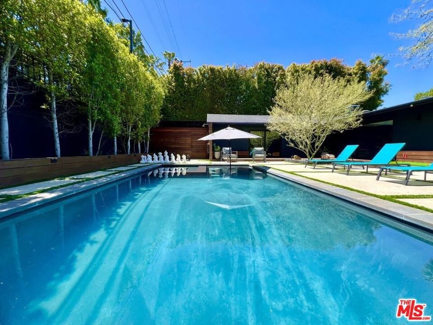 Available Medium Term 6 mos.+ to Long Term 1 year+  Fully Furnished & Fully Equipped.  Discover an oasis just steps away from Ventura Blvd's vibrant scene of entertainment, dining, and shopping. Nestled on a serene residential street, this property offers the perfect blend of convenience and tranquility.  Escape to a private sanctuary shielded by mature trees and fence walls, enveloping the backyard, pool, and jacuzzi in near-total seclusion. Centrally located at the nexus of the 405 and 101 highways access to Hollywood, Beverly Hills, Universal City Theme Park, West Hollywood, beaches, downtown, and all that Los Angeles offers is effortless.