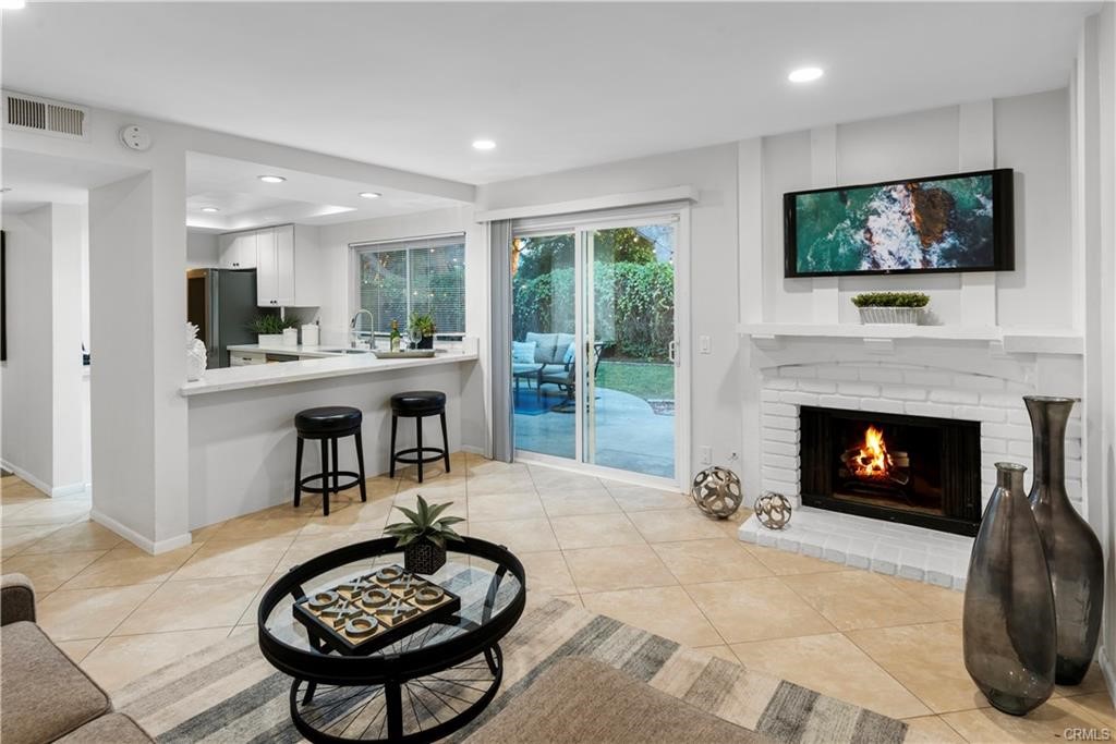 Beautiful 4-bedroom home in the heart of the Northwood Community in Irvine. Proudly situated on a quiet street with large mature trees and back to the serene Venta Spur walking trail with no neighbor behind. Double entry leads to formal living/ dining area with a remodeled, built-in wet bar. Newer laminate flooring in main living area, tile in wet areas and carpet on stairs and in all bedrooms upstairs. The modern kitchen has been remodeled from top to bottom with shaker style cabinets, quartz countertop, recess lighting, all stainless LG appliances with gas cooktop and refrigerator. Cozy fireplace in the family room with direct access to the resort-like large backyard. Well maintained landscape with low maintenance plants and mulch. Perfect oasis to enjoy the California sun. Large master bedroom with vaulted ceiling, recess lighting and a private & peaceful tree-lined view. All bathrooms have been renovated. Entire house has dual-pane windows and No carpets, laminated wood & Tile throughout, newer HVAC system. Close to community parks, schools, shopping, restaurants and easy access to freeway. Award winning Brywood Elementary School, Sierra Vista Middle School and Northwood High School. Make your appointment to see the house today!