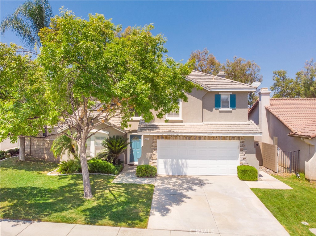 Welcome to 3428 Birchleaf Drive, a stunning entertainer’s dream home nestled in the highly sought-after Autumnwood/Mountain Gate community of South Corona. This beautifully upgraded residence offers approximately 1,896 square feet of thoughtfully designed living space with 3 spacious bedrooms and 2.5 baths, all situated on a generous 5,048 sq ft lot. Step inside and be greeted by a light-filled interior featuring a formal dining area/family room near the entry, perfect for elegant gatherings, and a custom bar that elevates your hosting game. The living room and kitchen are united by beautiful ship lap ceilings, adding warmth and charm to the heart of the home. The fully remodeled kitchen is a chef’s delight, equipped with brand-new, matching KitchenAid appliances, sleek countertops, designer backsplash, an island and ample cabinet space—all flowing effortlessly into the open-concept dining and living areas. Retreat to a luxurious primary suite with a spacious en-suite bath, with a separate tub and shower, dual vanities, and walk-in closet. Every inch of this home has been updated with comfort and style in mind, including plantation shutters, recessed lighting, and premium flooring throughout. Step outside and discover a private backyard oasis built for year-round enjoyment. This entertainer’s paradise features a sparkling pool and spa with stunning fire bowl features, a fully equipped outdoor kitchen, a cozy outdoor fireplace, and even a putting green for the golf enthusiast. Whether you're hosting summer barbecues or relaxing by the fire on cool evenings, this yard was designed for unforgettable memories. If that isn't enough and you don't fell like cleaning up there is also a community pool just steps away. Located near top-rated schools, parks, shopping, and with easy freeway access, 3428 Birchleaf Drive combines luxury living with everyday convenience. With its unmatched upgrades, inviting floor plan, and resort-style outdoor amenities, this home truly checks every box.