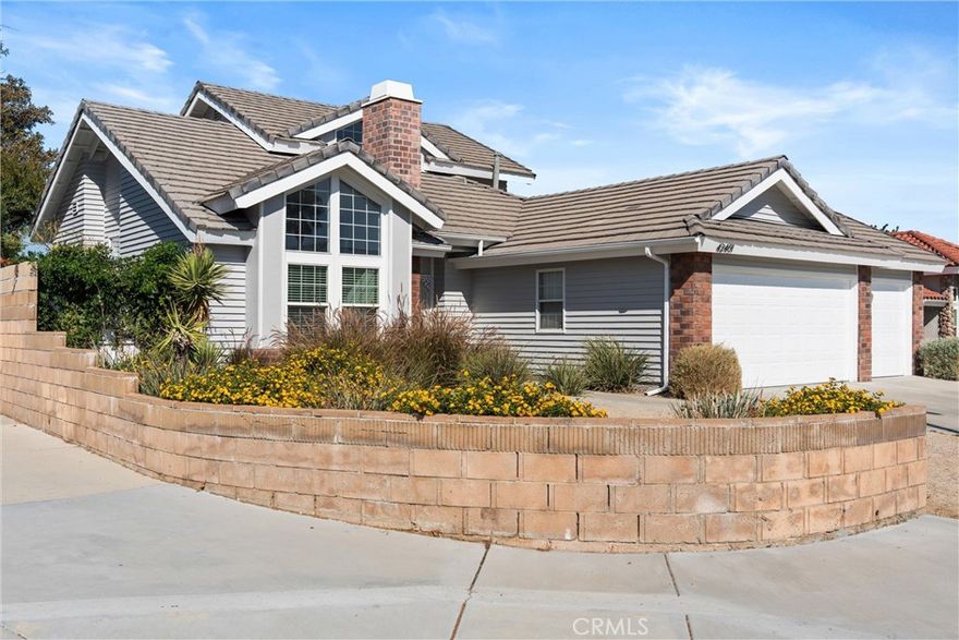 Discover Your Quartz Hill Dream Home! Welcome to this stunning, beautifully updated home that offers both curb appeal and an incredible sense of space. This highly sought-after Quartz Hill property is perfectly situated on a corner lot with a retaining block wall, offering exceptional convenience near the high school and grade schools. The entire exterior has just been professionally painted, complemented by a handsome tile roof and custom brick front accents. Step inside to a home that is both elegant and practical. With new interior paint and thoughtful accents. The formal living room atmosphere is fresh and inviting, and boasts a custom fireplace surround, creating a perfect gathering space. The kitchen features tiled counters and custom flooring, and it opens to a family room with a convenient built-in desk. The flexible floor plan includes two bedrooms downstairs, providing ideal options for guests or a home office. The upstairs master suite is a private retreat with vaulted ceilings and a balcony overlooking the backyard. The master bath offers the convenience of two separate vanities and sinks and a large walk-in closet. This home sits on a huge lot of over 10,000 square feet, designed for the ultimate outdoor lifestyle with dual sliding patio door. The beautifully landscaped backyard features an expansive concrete patio and hardscape. For the car enthusiast or hobbyist, this home comes with a three-car garage and a EV charger, along with cemented RV access. This is a must-see property that perfectly blends comfort, style, and amazing outdoor potential!  *****Seller will consider all offers, including those offers that include Concessions*****