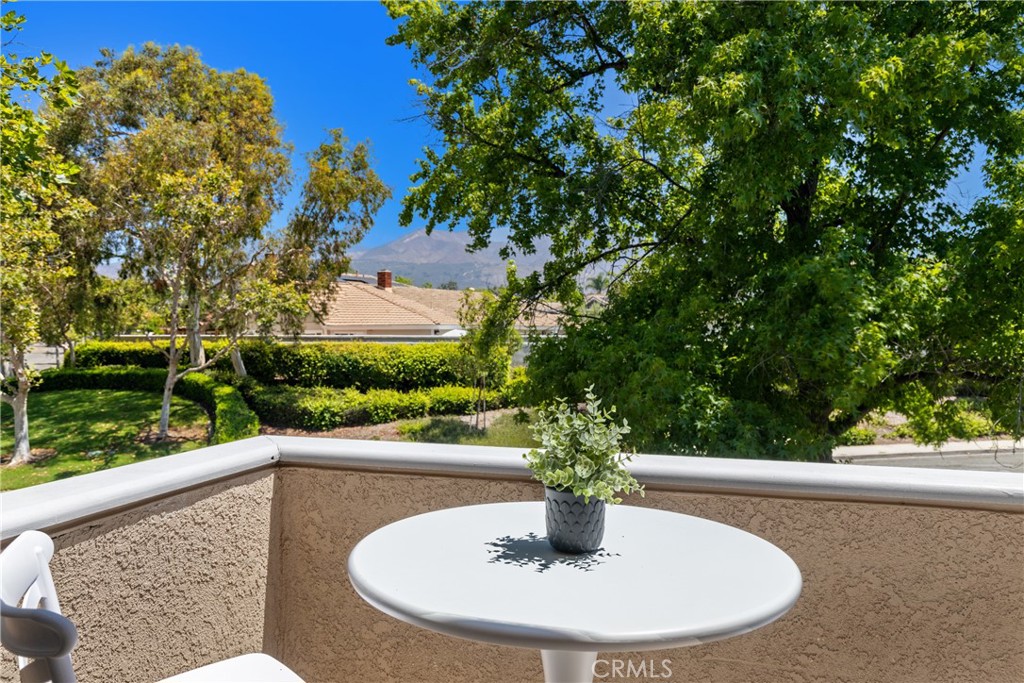 Welcome to this beautifully updated upper-level condo in the heart of Rancho Santa Margarita! This bright and airy two-bedroom, one-bath home features warm neutral-tone laminate flooring, fresh baseboards, and timeless white paint throughout. Enjoy your own private front porch shaded by mature trees—perfect for morning coffee or evening unwinding—with a peaceful view of the Saddleback Mountains in the distance. The kitchen and bathroom shine with sparkling quartz countertops in “Sparkling Ice,” complemented by freshly painted cabinets and modern hardware. Enjoy vaulted ceilings in the living and dining areas that create a spacious, open feel, along with stainless steel appliances and an in-unit stackable washer and dryer for everyday convenience. The private gated entry and dedicated carport offer both security and ease. You'll love the resort-style amenities including a pool, spa, and access to the picturesque RSM Lake. Located in a pet-friendly community that's walkable to schools, shops, and restaurants—and with easy access to the 241 Toll Road—this condo is the perfect blend of comfort, style, and location!
Features You’ll Love:
• Two Bedrooms, One Bathroom and CORNER / END unit!!
• Warm neutral-tone laminate flooring & fresh baseboards
• Bright quartz counters (Sparkling Ice!) in kitchen & bath
• Freshly painted kitchen cabinets with new hardware
• Freshly painted throughout in timely neutral whites
• Stainless steel appliances (dishwasher + oven)
• Upstairs unit with vaulted ceilings in living room & primary bedroom = airy & inviting
• Private gated porch entry + assigned carport #118
• Closest official parking spot PLUS Excess parking on street at Corner
• Mirrored closet doors, in-unit stackable washer/dryer
• Access to resort-style pool, spa, and RSM Lake & amenities & Super Close to on site Pool!
• Pet-friendly (HOA pet restrictions in place) and walkable to schools, shops, and restaurants
• Super convenient to the 241 Toll Road
Whether you’re upsizing, downsizing, or rightsizing – this cheerful condo is calling your name! Make your move now and be settled in before the holidays begin!