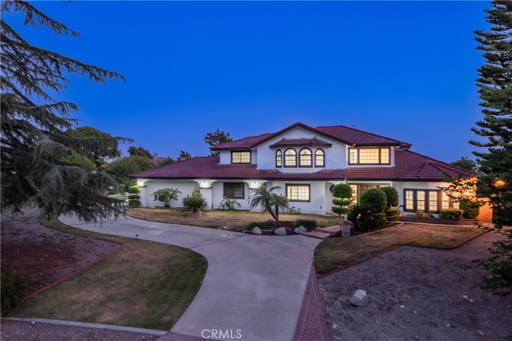 NEWLY REMODELED!!! This gorgeous estate situated on a 37,113 SqFt (ALL FLAT LOT) surrounded by citrus and fruit trees. It features 4 bedroom 3 baths with 4 car garage attached and RV parking. Large living room connect to the formal dining room. The chef's kitchen with custom cabinetry, quartz counter tops, large islands and opens to the family room with fireplace is perfect for entertaining family and friends. newly installed wood and porcelain tile flooring, recesses lighting, and new sliding-doors throughout. Upstairs offers the deluxe master suite with sliding-door to the balcony to enjoy the view of the mountains. Resort like master bathroom with standalone soaking tub and walk-in closet. 2 additional secondary bedrooms with a full bathroom and Loft/bonus room with wet bar. HUGE backyard with covered patio, room for pool, tennis court and room to built ADU. Walking distance to Claremont wilderness walking trails, Thompson Creek Trail, and close to parks, The Webb private school and Claremont Village. This location with stunning mountain views and peaceful serene surroundings.