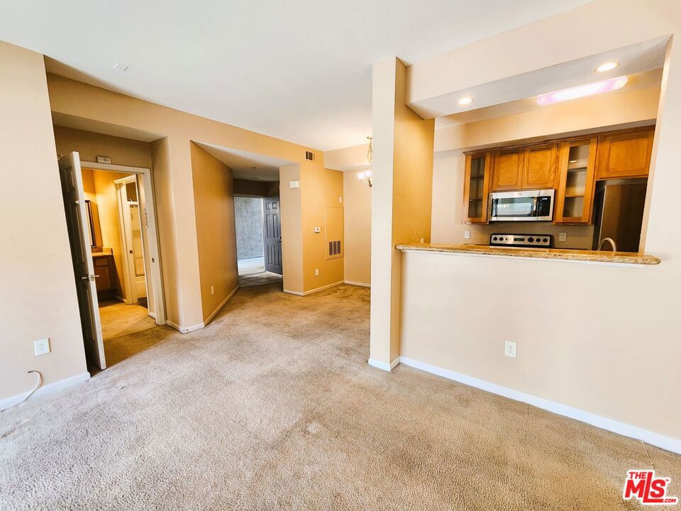 Welcome to your new home in the picturesque, gated community of Sonata at Canyon Crest! This inviting 2 bedroom, 2 bathroom condo offers a serene retreat for anyone but is also perfect for students and faculty alike. Step inside to discover the living room which creates an inviting atmosphere for both entertaining and everyday living. The enclosed private patio off the spacious living room beckons for moments of relaxation and open air dining. It also includes an extra storage area. The inclusion of all appliances, in-unit laundry, and a dining area adds convenience and practicality to the space. The unit also includes granite countertops in the kitchen and bathrooms. The comfort of the main bedroom with its own ensuite bathroom provides a private sanctuary within the home. Outside the condo, the community amenities are second to none, with a clubhouse, tennis courts, pool, and spa offering opportunities for leisure and recreation. The well-manicured grounds provide a tranquil setting for walks and outdoor activities. Conveniently located near the UC Riverside campus, as well as a variety of shopping, coffee shops, and restaurants, this condo offers the perfect blend of comfort and accessibility. Don't miss out on this exceptional opportunity to make Sonata at Canyon Crest your new home!
