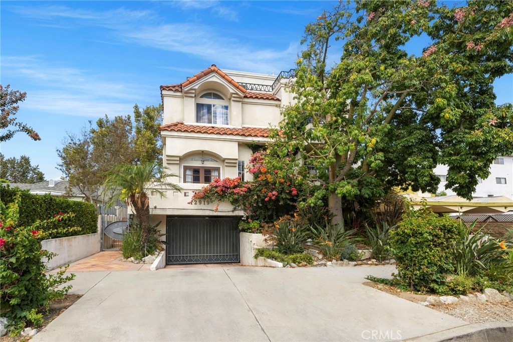 Welcome to 12919 Bloomfield St – A Mediterranean Inspired Townhome in the Heart of Studio City. This spacious 3-bedroom, 3-bath townhome offers 1,872 sq. ft. of thoughtfully designed living space in one of the Valley’s most desirable neighborhoods. Step inside to find a bright open-concept layout, featuring a remodeled contemporary kitchen with sleek finishes, a generous living area perfect for entertaining, and oversized windows that flood the home with natural light. Upgrades include a brand-new HVAC system and an EV charger, adding convenience and efficiency. Each bedroom is well-proportioned, with the primary suite showcasing ample closet space and a beautifully upgraded spa-inspired bathroom. One of the highlights of this home is the private rooftop deck, boasting almost panoramic views of the surrounding hills and neighborhood—the ideal spot for evening sunsets, weekend gatherings, or simply enjoying the fresh air. Located just moments away from the brand-new Sportsmen’s Lodge shopping center, as well as popular dining, boutiques, and local hot spots, this home offers both convenience and lifestyle.
