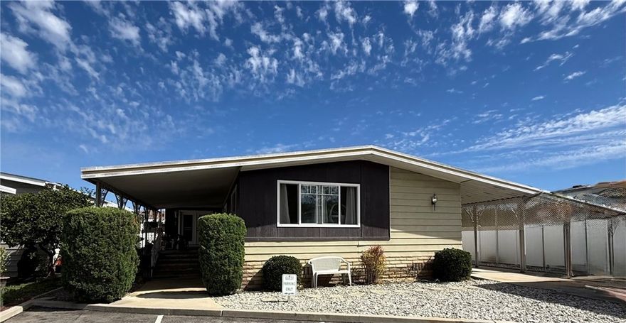 Boasting 1,992 square feet, this quad-wide is one of the largest manufactured homes in Huntington Beach. Completely remodeled, it features a drywall interior, upgraded electrical, a cozy fireplace, modernized kitchen and bathrooms, spacious bedrooms, a wet bar, utility room with washer and dryer, central air conditioning, three-car parking, and an oversized covered front porch.



Located next to guest parking and just steps from the community clubhouse, swimming pool, and spa, this home offers both convenience and comfort. Only 3 miles from Huntington State Beach, you’ll quickly see why so many residents love calling Los Amigos home.