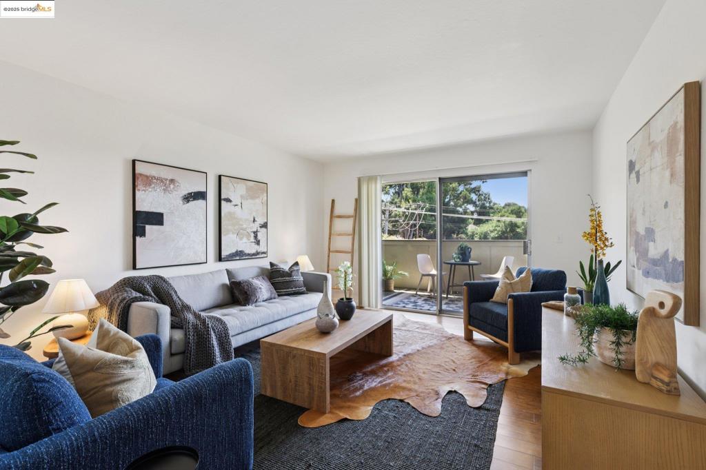 Experience comfort and tranquility at 1502 E St Unit 6, a bright 2-bedroom, 2-bath condo with 1,075 sq ft of living space. This home is filled with natural light and surrounded by greenery. The open living area extends to a private balcony overlooking the trees, giving the unit a peaceful, airy feel. The updated kitchen boasts stainless steel appliances, ample cabinetry, and room for a cozy dining nook. Both bathrooms have been tastefully remodeled, and the in-unit washer/dryer adds everyday convenience. The primary bedroom is generously sized, featuring a large walk-in closet and flexible layout to suit your needs. Enjoy covered parking, extra storage, and a convenient location near downtown Hayward, trails, shopping, and public transit. Whether you're commuting or working from home, this condo is a smart choice!