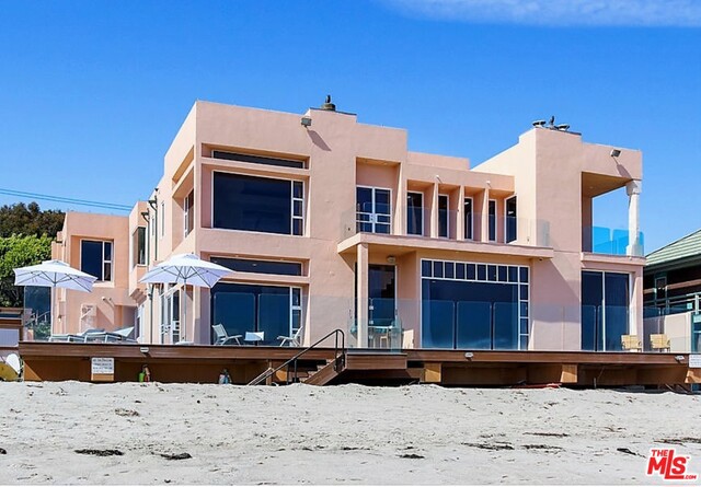 Experience the joy of living in Malibu on our best deep sandy beaches. Escondido Beach is a private road just south of Paradise Cove w/ views from Pt. Dume to Santa Monica Bay. This popular & sought after location offers privacy, a great swimming beach & one of the best accesses for stand-up paddling. Stunning, Tom Torres designed Architectural Home is approx. 6100 SF of high ceilings, walls of glass, ocean views from almost every room on approx. 80' of extraordinary sandy beach frontage. Entry courtyard w/koi pond leads into spacious 2 story living room, dining room, media rm, huge cooks kitchen, custom ocean front bar, breakfast area w/easy access to wrap around deck & sandy beach. Upstairs there are 3 additional bedrooms plus an incredible master with a "one of a kind coastline view", huge bathroom/dressing area, generous closets and private balcony. A basement includes large wine cellar, music area, generator and tons of storage. Adjacent 50' parcel also available for sale.