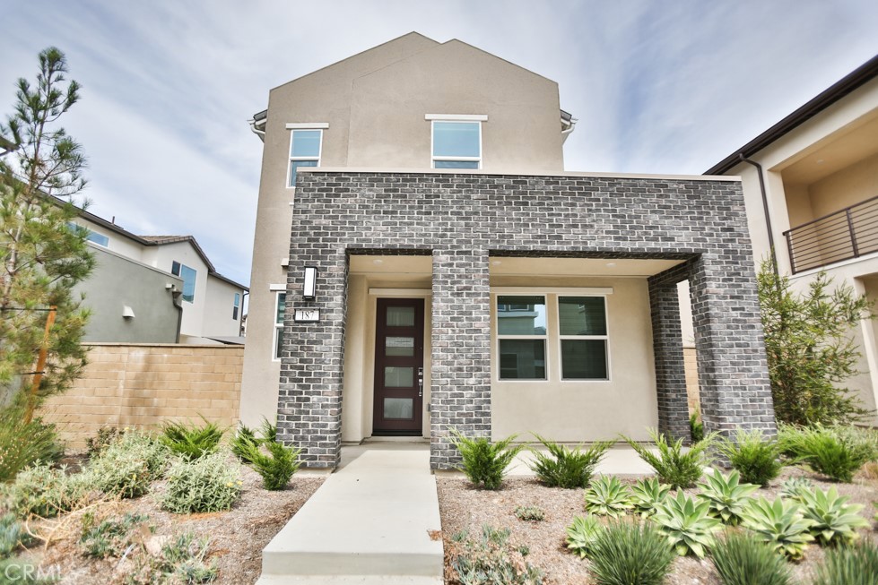 Just steps from the brand-new Luna Park in Irvine’s coveted Great Park community, this rare Selene model is a must-see! Boasting 3 bedrooms, 2.5 baths, and 1,936 sq. ft. over two thoughtfully designed stories, this home blends modern elegance with family-friendly functionality. Main living areas feature light wood-tone vinyl plank flooring, while bedrooms are adorned with plush upgraded carpet. The open-concept first floor includes living, dining, kitchen, and a private den, with a gourmet kitchen showcasing quartz countertops, white shaker cabinets, and stainless steel appliances including a 5-burner gas cooktop and built-in oven.
Upstairs, all bedrooms are privately tucked away. Two spacious secondary bedrooms share a full bath with bold hexagon tile flooring, quartz countertops, double sinks, and a separate tub/shower area. The oversized primary suite is a true retreat, offering space for a seating area, a spa-inspired bath with a large step-in shower, dual vanities, and a walk-in closet with a custom organizer.
The spacious side yard is low-maintenance with artificial grass and drought-tolerant plants. Additional perks include a finished garage with epoxy floors, custom window coverings, and owned solar.
Luna Park, just steps from your door, is a stunning 13-acre community park featuring two swimming pools, multiple sports courts including pickleball and basketball, playgrounds with a ninja course and zip line, barbecues, shaded areas, a large lawn for events, and a community gathering space. With top-rated schools and a vibrant, family-friendly neighborhood, this Irvine gem is ready to welcome its next lucky owner!