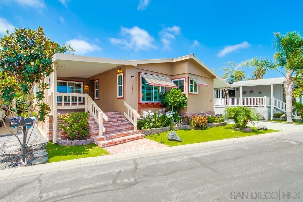 This spacious, move-in ready home offers 3 bedrooms, 2 full baths, and a 2-car carport in the sought-after 55+ guard gated community of Rancho Carlsbad Country Estates. The open floor plan features vaulted ceilings, arched windows, and a stone fireplace. The oversized kitchen is perfect for entertaining, featuring a large island, generous storage, and a dedicated dining space. Large private covered back deck overlooking the creek and open space—ideal for relaxing or gathering with friends under the Carlsbad sun. Enjoy resort-style amenities including a heated (year-round) pool, spa, fitness center, pickle ball, tennis and more. The clubhouse offers a ballroom, billiards, table tennis, card room, arts & crafts studios, a two-story library, and an outdoor patio with a gas grill. Live the active lifestyle you’ve been waiting for in one of North County’s most desirable communities—just minutes from beaches, shopping, golf, and more. Home is a manufactured single detached home, you own the land, montly homeowners association is $485/month.