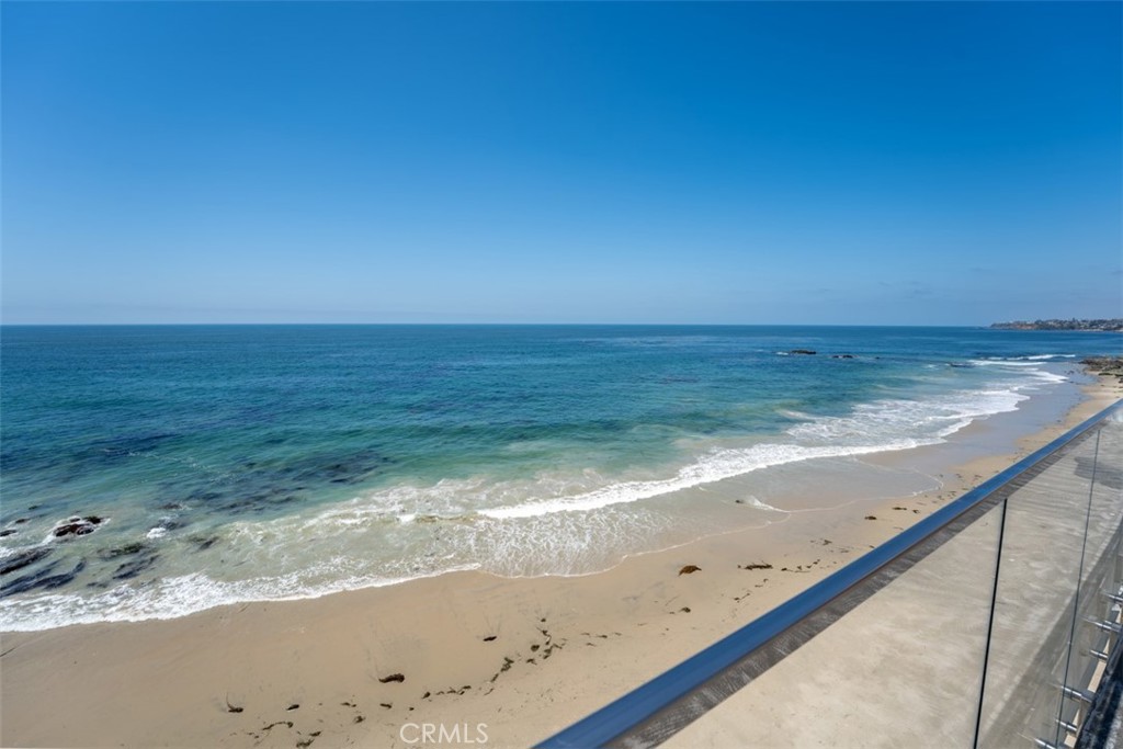 OCEANFRONT! Available June 2025 and on. Fully furnished Turnkey, just bring your suitcase. Recently remodeled and upgraded "Toes in the Sand" Oceanfront End-Unit Gem is an exceptionally rare opportunity to lease within Laguna Sands with no PCH noise. HEAR THE OCEAN AND FEEL THE OCEAN SPRAYS ACROSS THE 35 FT PRIVATE OCEAN VIEW DECK! Offering incredible white water and Catalina Island views within only a few steps to the front door from the private gated underground garage. Floor to ceiling sliding glass doors boast pristine ocean views throughout the main living areas and expansive balcony deck. Fresh contemporary finishes radiate Laguna Beach hideaway throughout this extremely immaculate and well maintained condominium including: all new custom kitchen appliances with Carrera marble countertops, ceramic tile on the diagonal throughout, 10' ceilings, recessed lighting throughout, and private front loading washer and dryer. Enjoy direct access to the beach or the private heated community pool and two rooftop decks. Truly a wonderful opportunity, right in the heart of Laguna Beach, neighboring the Surf and Sand Resort, top restaurants, shops, galleries, and only within a couple minutes of downtown.