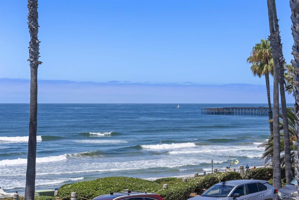 Panoramic white-water views set the stage at this brand-new modern beach home on Oceanside’s iconic Pacific Street. Just steps from the sand, this is one of two newly completed residences in a striking duplex—each with its own utilities and legal parcel number. Don’t miss the rare opportunity to purchase one or both homes and own the entire building, offering the flexibility for investment or multigenerational living (Other address is 212 S Pacific St MLS # NDP2507463). This top floor 5-bedroom, 2.5-bath home offers 2,650 sq ft of light-filled space with clean modern finishes throughout. The open-concept main living area flows directly to a spacious ocean-facing deck—perfect for dining al fresco, watching surfers skim the waves, and taking in the unforgettable sunsets. The oversized primary suite includes a retreat area, walk-in closet, and private balcony. Additional highlights include a 1-car garage plus tandem covered parking, ductless A/C throughout, and a west facing ground level patio, with ocean views of course! Enjoy effortless access to the beach right across the street, bring your surfboards and boogie boards! Ideally located just two blocks to the Oceanside Pier and within walking distance to the city's best restaurants, rooftop bars, cafes, and the weekly farmers market. With prime beach access and short-term rental potential, this property offers both an exceptional lifestyle and investment opportunity. Own a piece of the coast on one of Southern California’s most desirable beachside streets.