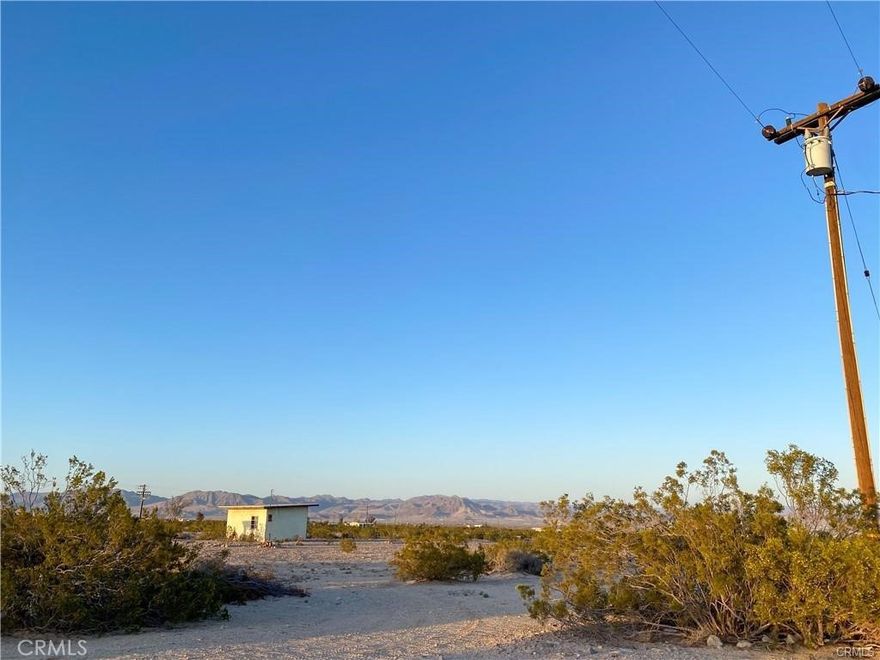 A great opportunity presents itself here with this property! This property has all you need to get started on creating your own slice of heaven! This area sits on a generous 5 acres of land! The connecting properties to the southeast include 60 acres of government-owned land, so that land will never be built on or developed! The surrounding land makes for great open views and perfect opportunities for endless outdoor activities and adventures. This property has water on-site and has had electrical power to the building with evidence of a previously installed electrical meter (see pictures). The power pole is just south of the property line by approximately 50 feet. This property is also off two main paved roads, which means easy access! With five acres of land, the possibilities are endless! Whether you want to build your dream outdoor getaway paradise, create a tranquil gardening space, or ride your quads on an adventure into the great outdoors, whatever dreams and desires you may have, this property can help make all your dreams a reality! Don’t miss out on this wonderful opportunity!