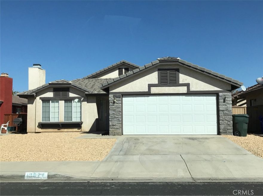 Discover the convenience of living in this western Victorville neighborhood, just moments away from schools, shopping, and easy freeway access. This single-family home features both a spacious living room and a cozy family room, complete with a warm fireplace and a patio door that opens to your private, fenced backyard – perfect for relaxation or entertaining. The well-designed kitchen boasts a gas range, a dishwasher, and tiled countertops, making meal prep a breeze. The primary bedroom includes a convenient ensuite bathroom for your privacy and comfort. Freshly painted and move-in ready, this home is waiting to welcome you! Please note that renter's insurance is required. Small pet considered.