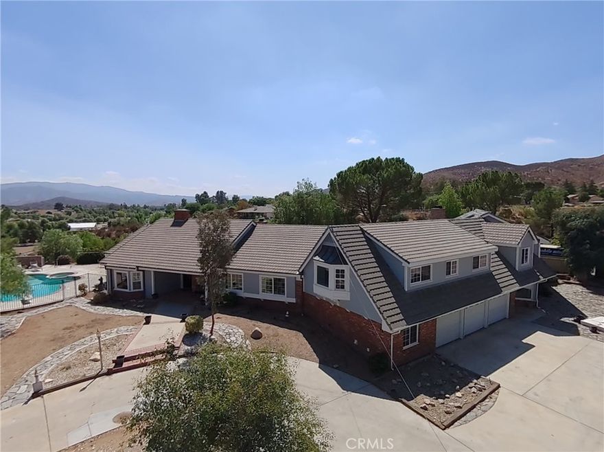 PRICE REDUCTION!! Price reduced for a quick sale. Welcome to your private retreat in the heart of Agua Dulce! This stunning ranch-style estate sits on over 5 acres (217,845 sqft) of fully fenced land, offering breathtaking views, privacy, and plenty of room to live, entertain, and enjoy the outdoors.



The residence spans 4,969 sqft and features 5 bedrooms, 4 bathrooms, and 2 primary suites—including one on the main level with direct backyard access. The heart of the home is the country-style kitchen, complete with a large granite island, built-in brick and granite dining table, Wolf 6-burner stove with 2 oversized ovens, griddle, and chef-inspired amenities. Additional living spaces include a formal living room, a family room with beamed ceilings, and a formal dining room.



The property also features an in-law suite with its own living room with a balcony and stairs leading to the yard, a wet bar, a fireplace, stained glass windows, and a private bedroom with French doors. The ensuite bath includes dual sinks, a jetted tub, steam shower, toilet room, and his & hers closets—perfect for multi-generational living or long-term guests. On the property, you’ll also find a 1-bedroom, 1-bathroom guest house/ADU, equipped with a full kitchen offering even more space and flexibility.



Enjoy resort-style outdoor living with a fire pit, sparkling swimming pool, and spa overlooking the valley. The circular driveway provides ample parking, while the lower level offers space for horses or additional facilities. The grounds are enhanced with drip irrigation, a fenced garden, and plenty of room to expand.



Upgrades include 3 central A/C units, 3 water heaters (including tankless), 2 propane tanks, a private well, 2 septic systems, main house septic system only 4 years old and a Tesla Solar System.