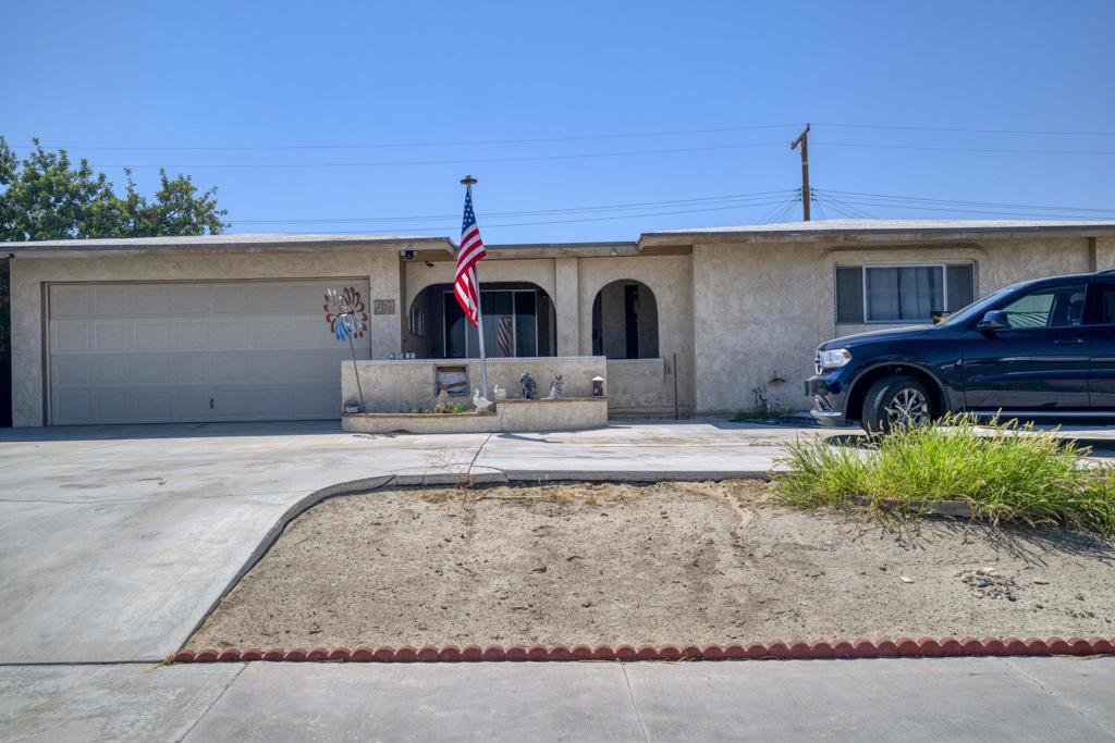 LOCATION, LOCATION, LOCATION!!! Perfect Primary Family Residence: Walking Distance to Indio Middle School.This charming 3-bedroom, 2-bath home also offers a den with a closet, previously used as a 4th bedroom. Guests are welcomed by a covered courtyard entry, providing both curb appeal and privacy. Inside, you'll find a light, bright, space with a comfortable, functional floor plan featuring wood-like laminate flooring. Living area boasts a skylight for extra natural light. Enjoy ample parking with a raised horseshoe driveway, side access to the backyard, and an oversized garage complete with custom built-in cabinets for extra storage. Don't miss out property! HOME TO BE SOLD AS!