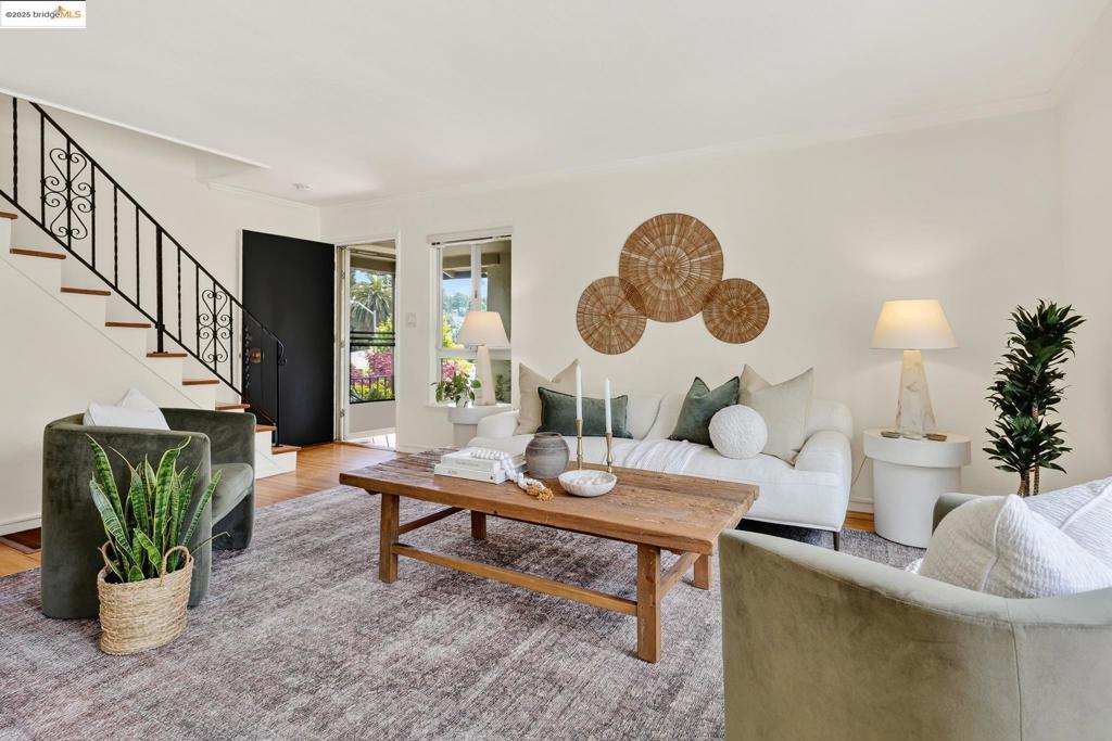 Inviting two-story, townhome-style condo in a 4-unit building, ideally located just steps from Montclair Village. Hardwood floors throughout, updated kitchen and bath, and a smart layout make this home move-in ready. The main level features a spacious living room, dining area, and kitchen with stone counters, tile backsplash, stainless steel appliances, and a stackable washer/dryer. Upstairs are two bedrooms and an updated bath. The primary bedroom has two closets; the second has great light and ample storage. Enjoy a fully enclosed private patio—perfect for relaxing, dining, or container gardening. 1-car garage and driveway parking. Situated on a lovely one-block street near cafés, shops, parks, trails, transit, and top-rated schools.