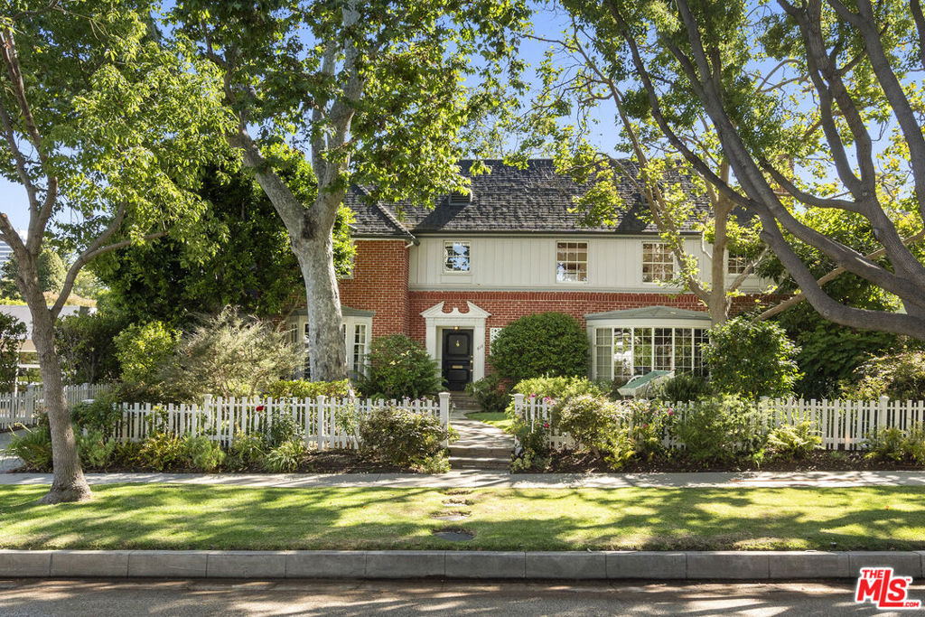 Charming two-story traditional in the coveted west end of The Beverly Hills Flats. Lots of original details juxtaposed with redone kitchen and bathrooms. Large formal living and dining room with den/family room and a large office/maids suite on the main level. Upstairs there are 4 large bedrooms plus a 2nd den/office. The backyard is filled with a grassy lawn and gardens. Great proximity to all the prime shops and restaurants in Beverly Hills, El Rodeo School and The Waldorf Astoria Hotel.