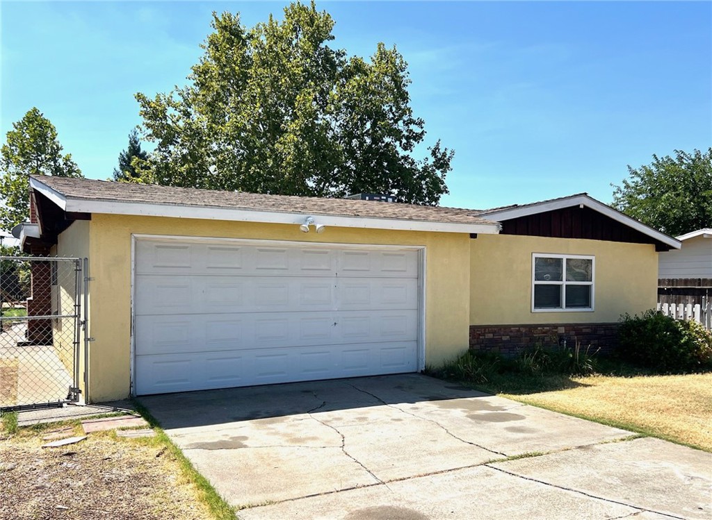 Welcome to this charming 3-bedroom, 2-bathroom home nestled in the established Sierra Gardens neighborhood in central east Merced. Offering 1,444 sq ft of comfortable living space on an 8,700 sq ft lot, this home is ideally located close to UC Merced, shopping, schools, parks, and offers easy freeway access. The inviting entryway welcomes you into a light-filled interior featuring an open-concept kitchen with extra storage and a gas stove—perfect for home-cooked meals. The primary bedroom features abundant natural lighting and a walk-in shower for easy access. A large bonus room with a beautiful brick fireplace, French doors, and plenty of windows offers the perfect space for entertaining or relaxing. Enjoy the fenced front yard with lovely plants and a spacious backyard complete with a pergola, ideal for gardening, a playset, or hosting family gatherings. This home combines comfort, convenience, and charm in a location that can't be beat.