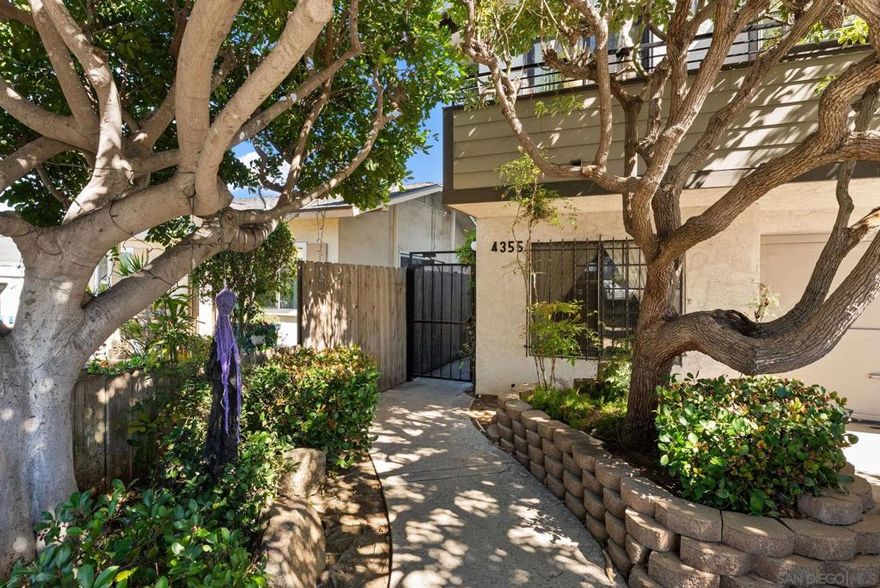 Step inside and welcome home to this sharp 2 bedroom, 2 bathroom single level home in a well maintained,  small 7 unit gate community walking distance to restaurants, bars and shops, even a Michelin Key award winning hotel.  This North North Park home is even walking distance to University Heights favorites!  San Diego living at it’s best with low homeowner fees but lots of smarts, charm and character.  This move in ready ground level unit has no stairs but a beautifully and professionally remodeled kitchen that looks onto it’s private back yard/patio!   Two nice bedrooms and two full (tub and shower) bathrooms, one attached, and both BRs enjoy spacious closets upgraded by CALIFORNIA CLOSETS!  Brand new (2022) dual paned slider door from primary bedroom to the back outdoor area.   Also new dual paned windows in living room, kitchen and bedroom; new plantation shutters; luxury vinyl plank flooring. NEST thermostat; YALE Smartlock; Welcome home!  See supplement for more  This home truly does have it all...from its walkability to restaurants, coffee shops and bars on El Cajon Blvd. and 30th St. (Lafayette Hotel just got a Michelin Key; Cafe Madeleine; Thai Time NP; Working Class; Pour House & Belching Beaver NP; Leila; Observatory NP; Part Time Lover; COLLINS & COUPE & more!!) to the beautifully updated flooring, open kitchen with tons of counter space, gorgeously remodeled bathrooms, recessed lighting, in-unit washer/dryer, central air conditioning, ceilings fans in 3 rooms, private patio yard off the primary bedroom, cozy fireplace for those quiet nights at home, and 3 (tandem) parking spaces, it’s going to be hard to beat this one!  Tastefully updated: Sellers replaced back (primary) bedroom slider door with brand new dual paned.  They also recently remodeled the entire kitchen!  NEW in 2025: Edward Martin Porcelain checkered tile; new quartz countertops; new GE oven with air fry; new Zephyr under cabinet range hood; new GE French Door refrigerator with filtered water and ice maker; new kitchen sink work station with glass rinser feature; new instant hot water dispenser!  Bosch dishwasher. Central A/C.   This gem is centrally located in the heart of one of San Diego’s most desirable neighborhoods, North Park! Come take a look for yourself and experience all that this lovely home and neighborhood have to offer.