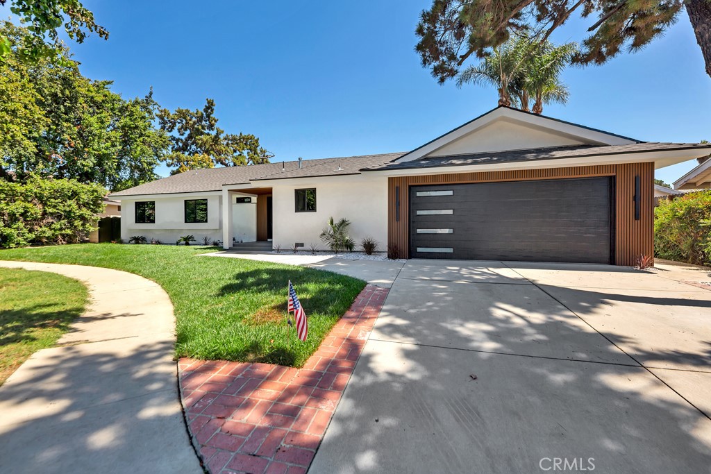 OUTSTANDING MODERN MASTERPIECE | WELCOME TO THIS 3 BEDROOMS 2 FULL BATHS HOME BEAUTIFULLY DESIGNED WITH TONS OF CUSTOM FINE FINISHES| BOASTING 1986 SQFT OF LIVING AREA| AS YOU WALK IN YOU WILL BE DELIGHTED WITH THIS UNIQUE SMOOTH STUCCO FINISHED, CUSTOM MODERN DOUBLE ENTRY STEEL FINISHED DOOR | MAKING THIS HOME STAND AS A ONE OF A KIND | OFFERS A SPACIOUS DESIGNER KITCHEN WITH AMPLE CABINETRY & BRUSH GOLD FIXTURES | MODERN CUSTOM DROP CEILING AND LARGE CENTER WATERFALL ISLAND | OFFERS TOP QUALITY DUARBLE STAINLESS STEEL APPLIANCES INCLUDING RANGE, DISHWASHER | AN ELECTRIC FIREPLACE WITH MODERN WOOD PANELING | OPEN CONCEPT LIVING WITH DESIGNER FINISHES | RECESSED LED LIGHTING AND CUSTOM DESIGNER INTERIOR DOORS ARE JUST A FEW OF THE MANY FEATURES OFFERED FOR THOSE LOOKING FOR SOPHISTICATION AND ELEGANCE| FEATURES BRAND NEW DOUBLE PANE WINDOWS | 4 TON CENTRAL AIR & HEAT UNIT WITH MODERN LINEAR BAR GRILL DIFUSER VENT | STUNNING MASTER BEDROOM WITH LUXURIOUS MASTER BATH WITH SHOWER & FREESTANDING MODERN BATH TUB | BRAND NEW GARAGE DOOR WITH REMOTE OPENER | WATER PROOF DURABLE SPC VINYL FLOORING | BRAND NEW ROOF | FULLY LANDSCAPED INCLUDING AUTOMATIC IRRIGATION SYSTEM | TOO MANY FEATURES TO DESCRIBE ALL. . COME SEE IT !!!