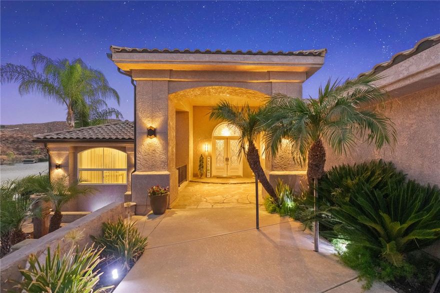 Welcome to luxurious lakeside living at this sprawling masterpiece in the amenity rich community of Canyon Lake! As you enter you will be in awe at the sight of the vaulted ceilings and jaw dropping lake views through the soaring windows offering an abundance of natural light. The first level of the home is designed for entertaining with expansive family and living rooms, along with a large bar offering the same dramatic lake views. Those in the kitchen will not be left out as it is adjacent to the bar and the family room, with direct access to the back patio overlooking the swimming pool and the lake. The primary suite also offers lake views along with a walk in closet, and a massive bathroom complete with a shower, bathtub, fireplace, linen storage and a private water closet. This level of the home includes two additional bedrooms with ensuite bathrooms, a guest bedroom, a guest bathroom and an indoor laundry room. This home does not end there! Downstairs off the pool deck you will find a game room complete with a bar and a bathroom, in addition to two more guest rooms and a jack and jill bathroom. Wander around the backyard and you will find a jacuzzi, a pool with a swim up bar, direct access to the shoreline of Canyon Lake, and multiple terraces offering great views of the annual 4th of July fireworks show. Lastly, the three car garage has been upgraded to include epoxy floor and premium garage doors for added curb appeal. Residents of this incredible community can take advantage of the recreational lake for wakeboarding, water skiing, swimming, paddle boarding, fishing, and more. Additional amenities include the Lighthouse Restaurant, swimming pool, tennis courts, pickleball courts, golf course, equestrian center, baseball fields, waterfront campground, and numerous parks, all of which are accessible by golf cart friendly streets. Seize the opportunity to capture your own “Little Bit Of Paradise” and schedule your private showing today!