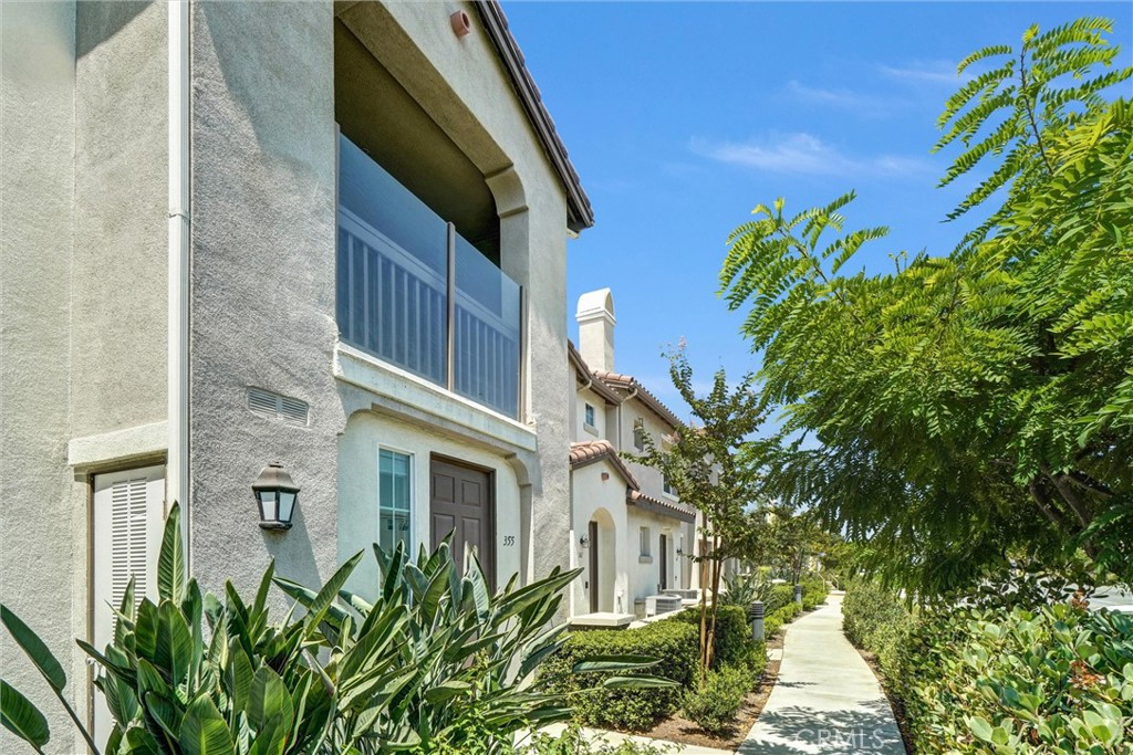 Located directly across from the Dad Miller Public Golf Course, this home offers a rare opportunity with golf course views and a prime West Anaheim location. While situated on a busy street, the scenic outlook and vibrant community setting more than make up for it. A fantastic opportunity for first-time buyers or investors alike, this home is located in the "Magnolia Lane" community by KB Home, known for its well-maintained surroundings and convenient location. This immaculate, end-unit townhome (attached on only one side) features two generously sized bedrooms and two full bathrooms, all on a single level. At the top of the open staircase, you’ll find a bright, open-concept layout with abundant natural light throughout. The inviting living room includes a cozy fireplace and media niche, with a sliding glass door leading to a spacious balcony—ideal for relaxing or entertaining. The kitchen is open and functional, featuring granite countertops, stainless steel appliances, and a casual dining area with balcony access. The primary suite boasts dual sinks, a walk-in closet, and granite countertops, while the secondary bedroom features mirrored closet doors. Additional features include an inside laundry area with stacked washer and dryer included, direct access to a two-car garage, and nearby guest parking. The community offers amenities such as a BBQ area, covered seating and picnic space, a playground, and grassy common areas. With no Mello-Roos and convenient access to freeways, Disneyland, Knott's Berry Farm, Soak City, shopping, dining, and schools, this home is light, bright, and move-in ready—a perfect blend of comfort, location, and value in a well-kept, HOA-maintained community.
