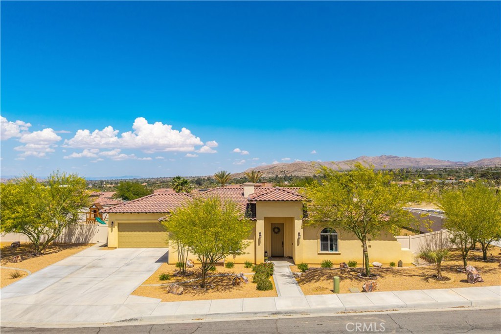 Beautiful 3 Bed, 3 Bath Pool Home with 3-Car Garage on a Cul-de-Sac!
Welcome to this stunning 1,898 sq ft, 3-bedroom, 3-bathroom pool home situated on a fenced corner lot in a quiet cul-de-sac in the desirable Mesquite Homeowners Association. This property blends privacy, function, and beauty—offering the perfect desert oasis. As you arrive, you’ll be greeted by beautiful landscaping, an extended concrete driveway for extra parking, and a charming courtyard entry complete with an outdoor fireplace—the perfect spot for morning coffee or evening relaxation. The backyard is fully enclosed with 6-foot privacy vinyl fencing and features a newer in-ground pool and spa (approx. 3 years old) with a pool heater, perfect for year-round enjoyment. There’s also a covered concrete patio, mountain views to the East, a new Tuff Shed, and even playground equipment that can be included! Inside, the spacious kitchen is a showstopper with granite countertops, a large center island, sleek in-cabinet trash can, a new chandelier, and updated lighting throughout. It’s open to the living and dining areas, all with views of the beautifully manicured backyard and pool. The two guest bedrooms are joined by a Jack-and-Jill bathroom, and the primary suite is a luxurious retreat with a cozy nook, backyard access, and an ensuite bathroom featuring a freestanding clawfoot soaking tub, a large walk-in river rock shower with a rain shower head and wand, and dual vanities. You’ll love the massive attached laundry room with a utility sink, tons of storage, and countertop space—perfect for folding and organizing. The attached 2-car garage is fully finished, and there’s an additional finished 1-car garage for even more utility or hobby space. Other upgrades and features include: Reverse osmosis and water softener system, Wired security camera system, Fruit trees galore: cherry, pomegranate, orange, lemon, lime, nectarine. Affordable $60/month HOA payment plan. This home is truly turnkey and offers everything from comfort and style to privacy and practicality. Homes with this level of detail and amenities rarely last—schedule your private showing today!