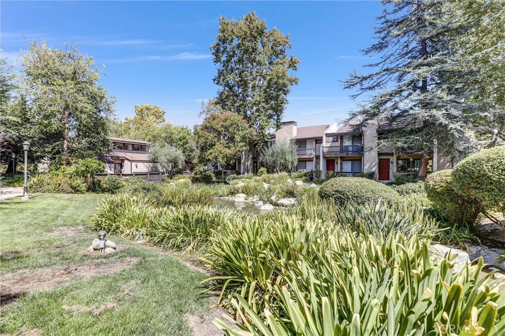 Fantastic Opportunity in Warner Center! Don’t miss this incredible chance to own a 1,666 sq. ft. townhome in the highly sought-after Warner Village III community. Perfect for buyers with vision, developers, or investors looking to get into the rapidly growing Warner Center area. This 3-bedroom, 2.5-bathroom residence features a versatile bonus room on the lower level—ideal for a home office, gym, or extra living space—just off the attached 2-car garage. The main level offers a living room, dining area, galley kitchen, and a convenient half bath. Upstairs, you'll find three comfortable bedrooms and two full bathrooms. The well-maintained complex offers resort-style amenities, including 3 pools and spas, a sauna, tennis court, 2 racquetball courts, a recreation room, basic cable, and earthquake insurance. Located close to Warner Center Park, the Rams facility, top-rated shopping, dining, and easy freeway access. With a little TLC, this home can be transformed into your ideal space.