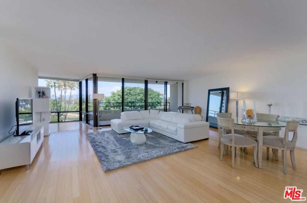 Your Elevated Marina City Club Lifestyle Awaits! Discover this fully renovated 3-bedroom, 2-bathroom residence at Marina City Club. Experience custom bamboo wood floors and abundant natural light throughout. The open, modern kitchen is a dream, boasting custom cabinetry, sleek Caesarstone counters, a built-in wine cooler, and premium stainless steel appliances. The generous living area, with its floor-to-ceiling windows, opens to a private patio offering panoramic tree-top, city, mountain, and dazzling city light views. Relax in your private master suite, complete with an en-suite bathroom. A unique second bedroom offers an additional private patio, perfect for a tranquil garden retreat. The versatile third bedroom is ideal for guests or a dedicated home office. Beyond your door, indulge in resort-style amenities including an executive gym, complimentary fitness classes (yoga, spin, stretch, and more!), three pools, six tennis courts, two paddle tennis courts, and three racquetball courts. Enjoy the convenience of an on-site gourmet restaurant and bar, daytime cafe, room service, and car wash. Peace of mind is assured with 24-hour gated and guarded security. All this, just a short walk to the beach and local restaurants!