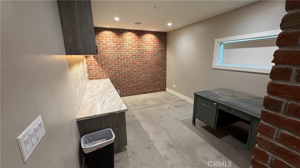 This property offers a newly renovated office featuring smart light switches, ceiling speakers, and a network rack, along with ample storage space above the office. The shop includes 12-foot clearance ceilings, two roll-up drive-in bays, and semi-truck access. Power is provided by a 200-amp, 3-phase open delta (240V) system with sub-metering, reconciled monthly with the building’s other tenant.
The office is equipped with a mini-split HVAC system, while the shop is cooled by a swamp cooler. Comcast Business cable and 5G internet are available, and the office is pre-wired for a security system should a tenant wish to install cameras. The property includes four parking spaces and offers 24/7 access without gated entry.
The lease is structured as Modified Gross, with water and sewer included and tenants responsible for all other utilities.