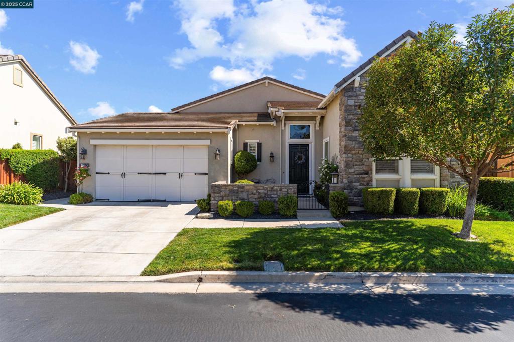 Welcome home to Trilogy's 55+ Resort Style Community. Once you enter this "Charming Home" you are greeted with an abundance of natural light. The high ceilings and spacious floorplan offer's the most decadent space for entertaining. The kitchen boasts an expansive island for all your entertaining needs. Stainless appliances, dual ovens, gas range, Solid Wood Cabinetry with pull out drawers and granite countertops. Adjacent to the kitchen is a cozy English sitting area with gas fireplace to curl up with a book and cup of tea. The open concept kitchen opens to a spacious family room perfect for all gatherings. When you step outside, you will find the most quaint and charming space. The brick patio and brick gas chimney fireplace is the perfect place to enjoy a glass of wine while you hear the relaxing sounds of the large, tiered fountain. Take a stroll down the walkway to the additional seating area under the wisteria covered trellis. This 2-bedroom, 2.5-bath home also features a spacious dining room with large blown glass chandelier, office, indoor laundry room with sink, hardwood and tile floors, ceiling fans, coffered ceilings in master bedroom, murphy bed in secondary bedroom, plantation shutters, epoxy flooring in the garage with built in cabinetry and so much more...