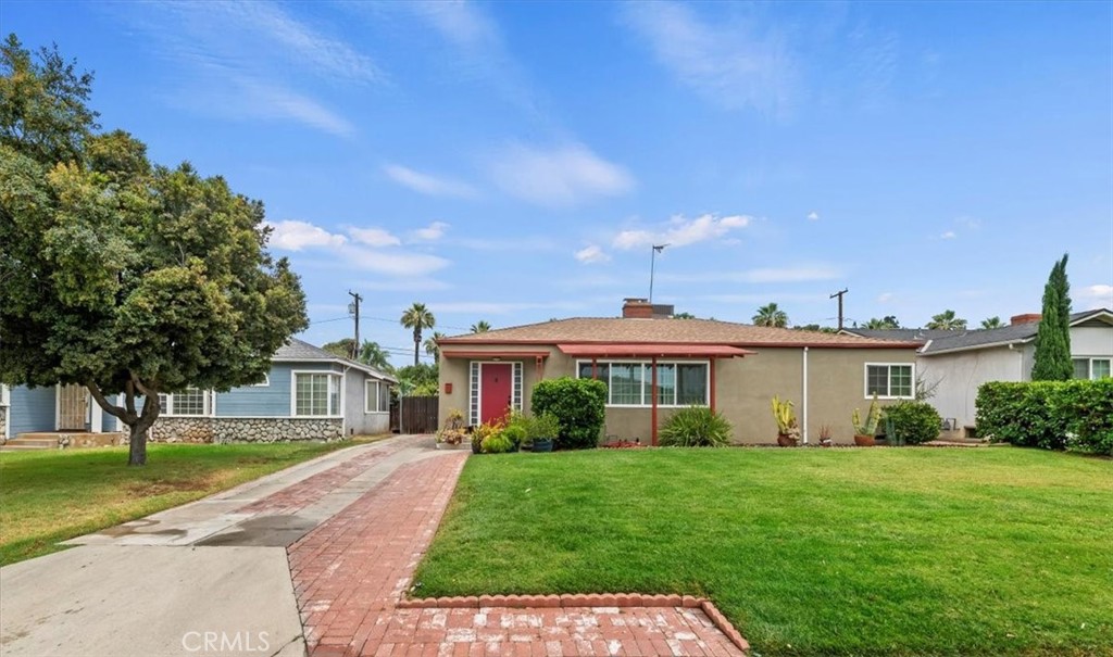 Welcome to this charming 4-bedroom, 1.5-bathroom home ideally located within walking distance of the vibrant Riverside Plaza. Perfect for families or anyone seeking extra space, this home blends classic character with modern upgrades. Inside, you'll find original resurfaced hardwood floors that bring warmth and timeless appeal to the home. The home is bright and energy-efficient thanks to brand-new dual pane windows throughout. Enjoy year-round comfort with a brand-new 4-ton air conditioning system and peace of mind under a newly installed roof. Step outside into your private backyard oasis featuring a sparkling pool and relaxing spa—perfect for entertaining or unwinding after a long day. With its unbeatable location, updated features, and classic charm, this home offers both convenience and comfort in the heart of Riverside.