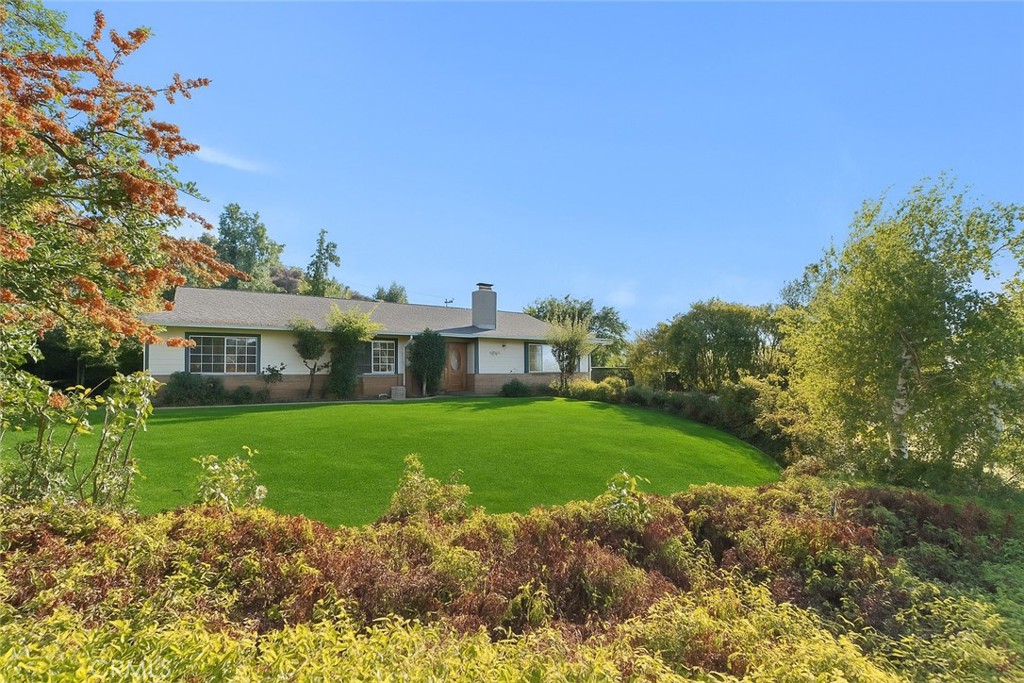 Experience elevated living with this stunning hillside retreat!
Set against sweeping mountain views, this beautifully remodeled 5-bedroom, 3-bath solar home sits on a spacious half-acre lot, offering the perfect blend of comfort, privacy, and style.
Step inside and you’re welcomed by an open, airy floor plan featuring a cozy family room with a fireplace, a formal dining space, and a bright, inviting kitchen designed for gatherings and everyday living. The oversized great room allows for effortless entertaining, while each bedroom provides generous space and storage.
The primary suite serves as a private sanctuary, complete with a walk-in closet, soaking tub, double-sided fireplace, and direct patio access—ideal for quiet mornings or relaxing evenings. A separate office space nearby makes working from home both easy and comfortable.
On the opposite side of the home, you’ll find a large fifth bedroom and a well-equipped laundry room for added convenience. Outside, a detached garage and RV garage provide more than enough space for vehicles, tools, or toys. The garage also includes a partially finished bonus studio—perfect for guests, a gym, or creative workspace.
With endless potential to design your dream backyard oasis, this property combines serenity, space, and functionality in one extraordinary package.
Come see why this hillside haven feels like home the moment you arrive.