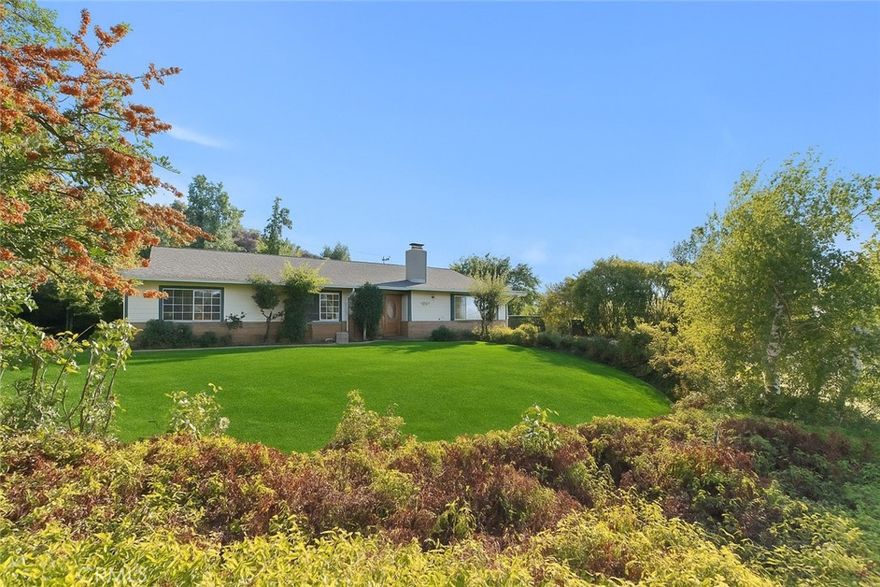 Experience elevated living with this stunning hillside retreat!
Set against sweeping mountain views, this beautifully remodeled 5-bedroom, 3-bath solar home sits on a spacious half-acre lot, offering the perfect blend of comfort, privacy, and style.
Step inside and you’re welcomed by an open, airy floor plan featuring a cozy family room with a fireplace, a formal dining space, and a bright, inviting kitchen designed for gatherings and everyday living. The oversized great room allows for effortless entertaining, while each bedroom provides generous space and storage.
The primary suite serves as a private sanctuary, complete with a walk-in closet, soaking tub, double-sided fireplace, and direct patio access—ideal for quiet mornings or relaxing evenings. A separate office space nearby makes working from home both easy and comfortable.
On the opposite side of the home, you’ll find a large fifth bedroom and a well-equipped laundry room for added convenience. Outside, a detached garage and RV garage provide more than enough space for vehicles, tools, or toys. The garage also includes a partially finished bonus studio—perfect for guests, a gym, or creative workspace.
With endless potential to design your dream backyard oasis, this property combines serenity, space, and functionality in one extraordinary package.
Come see why this hillside haven feels like home the moment you arrive.