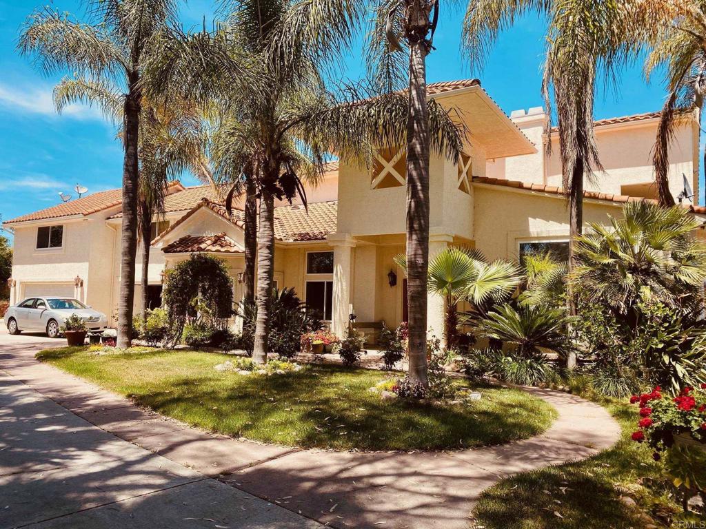 Welcome to your serene hillside retreat in Hidden Meadows! This impressive 6-bedroom, 4.5-bath custom home offers 4,014 square feet of elegant, versatile living on a private 1.09-acre lot—ideal for multi-generational living, remote work, or anyone seeking space and tranquility. Enter through a sweeping private drive framed by mature palms and lush landscaping, with abundant parking including a rare 5-car garage, RV/boat parking, and no HOA to limit your lifestyle. Inside, discover a thoughtfully designed floorplan with two main-level suites, four spacious upstairs bedrooms (including a Jack-and-Jill bath), and a large bonus room—perfect for extended family, guests, or a luxury home office. Sunlight pours through oversized windows, illuminating expansive living and dining areas that flow seamlessly for gatherings large or small. Multiple outdoor entertaining zones include flat patios, a covered deck, and peaceful hillside views. The chef’s kitchen features classic tile countertops, generous cabinetry, and an open layout ideal for everyday living and hosting. A unique second kitchen in the garage offers unparalleled convenience for celebrations, hobbies, or catering events. All bathrooms are beautifully maintained, complementing the warm wood flooring, elegant tile accents, and fresh, inviting ambiance throughout the home. Enjoy complete privacy and the freedom to personalize your 1.09-acre lot—perfect for future pool, gardens, or personal trails. Experience the best of North County living: tranquil hillside surroundings, room for all your toys, minutes to I-15, golf, and top local amenities. This is the ultimate retreat for those who value both luxury and flexibility!