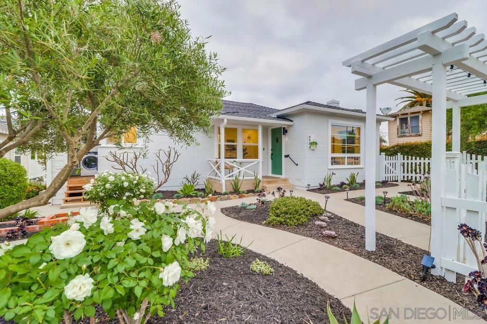 Welcome to a home that truly has it all - style, space, and an unbeatable location just steps from the heart of the Village of La Mesa. Whether you’re looking for the perfect multi-generational home, a savvy investment, or simply a sanctuary to enjoy the San Diego lifestyle, this property delivers it all with ease. Masterfully remodeled, the residence offers 6 bedrooms, 3 bathrooms, and multiple living areas across two fully self-contained units. Upstairs you’ll find 4 bedrooms, 2 bathrooms, and a chef’s kitchen, while the downstairs features 2 bedrooms, 1 bathroom, its own living room and kitchen, and a separate private entrance; functioning beautifully as a flexible granny flat or secondary living quarters. For a primary buyer, it’s an ideal setup for guests, teenagers, or a home office. For an investor, it’s turnkey-ready income potential. Curb appeal is undeniable with a picture-perfect white picket fence wrapping the entire front yard, preserving the charm of the home and neighborhood. Step into the backyard and you’ll discover your own fully fenced private retreat: a resort-style space designed for entertaining with a hot tub, fire pit, BBQ, oversized deck w/ lounge seating, and a plethora of space for games- all set under cafe lights and surrounded by lush landscaping. Additional highlights include: • Two units under one roof, with private entry for the secondary living quarters • Multiple living, dining & entertaining spaces • High-end kitchens with stainless appliances • Full laundry in both main house and secondary living quarters • Garage, driveway, and ample street parking • Furniture is negotiable • Pet- and family-friendly layout • Walkable location & quick freeway/trolley access This property has also been a highly successful Airbnb, offering proven upside for investors. For those seeking a forever home, it’s equally perfect: live upstairs while generating rental income from the secondary dwelling unit - or enjoy the entire home as a private retreat for family and friends. Set in one of San Diego’s most beloved neighborhoods, you’ll be just a stone’s throw from the Village of La Mesa, where locals gather at wine bars, coffee shops, boutiques, farmers markets, and festivals year-round. With its vibrant yet laid-back energy, walkable streets, and central location just 15 minutes from downtown San Diego, the beach, or the airport, it’s no wonder La Mesa is one of the county’s most sought-after communities. This isn’t just a home- it’s a lifestyle investment, where charm, convenience, and opportunity converge.