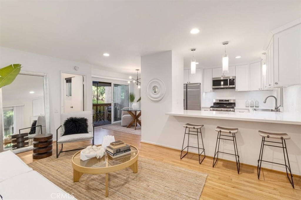 Discover luxury and convenience in this stunning, remodeled 1-bedroom end-unit condo at 25765 Marguerite #H104, Mission Viejo. This spacious, light-filled home boasts a chef’s kitchen, recently upgraded with sleek quartz countertops and a large bar perfect for entertaining guests. The open-concept design flows effortlessly, creating an inviting atmosphere for both relaxation and social gatherings.
Enjoy your morning coffee on one of two private patios—one overlooking lush greenery and trees, offering a serene retreat. The luxurious bedroom suite provides ample space and tons of storage, ensuring all your needs are met. New windows enhance energy efficiency and flood the home with natural light, highlighting the modern updates throughout.
Located in an amazing community, this condo is within walking distance to the scenic So Creek Trail, vibrant downtown restaurants, and charming shops. Golf enthusiasts will appreciate the nearby golf course, and commuters will love the quick access to the freeway. The HOA includes water and trash, adding to the ease of ownership. Parking is a breeze with one covered carport and an additional guest parking space, plus easy access from the carport to the unit.
This move-in-ready, light and bright condo combines privacy, style, and an unbeatable location. Don’t miss your chance to own this Mission Viejo gem!