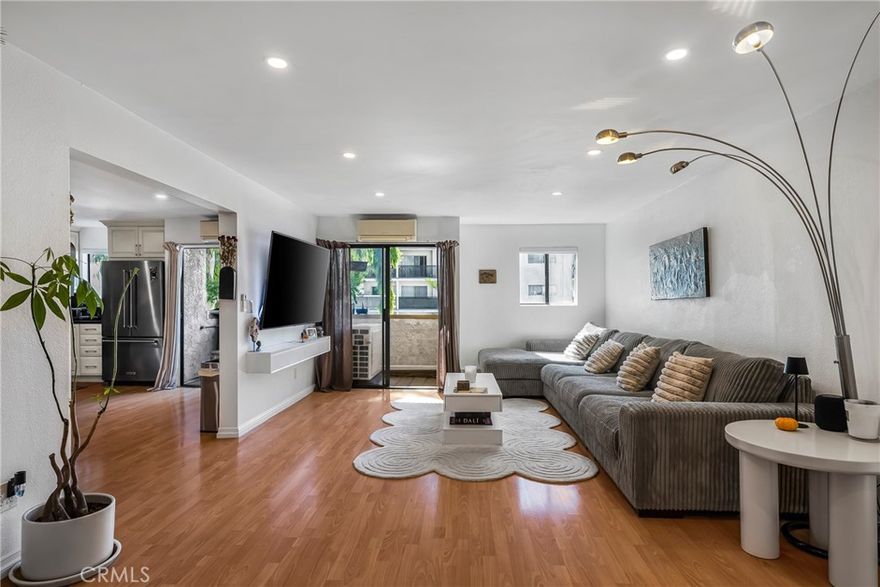 One of the larger units in the building, welcome to this beautifully updated 2-bedroom, 2-bath condo! Sunlight fills the open floor plan, creating a warm and welcoming atmosphere that’s perfect for relaxing or entertaining. Each bedroom serves as its own private suite, complete with a full bath—perfect for roommates or guests. As you walk in you are greeted with a spacious living room along with a dining area and large open kitchen and 2 balconies. The home is move-in ready, featuring recessed lighting, laminate floors, updated kitchen appliances, and updated interior paint throughout. Located in a gated building, residents enjoy peace of mind and access to desirable amenities, including a sparkling pool, jacuzzi, and a shared barbecue area for outdoor gatherings. Two tandem parking spaces are included for your convenience along with laundry room on every floor. This home offers the best of Tarzana living: comfortable, secure, and close to shops and freeway.