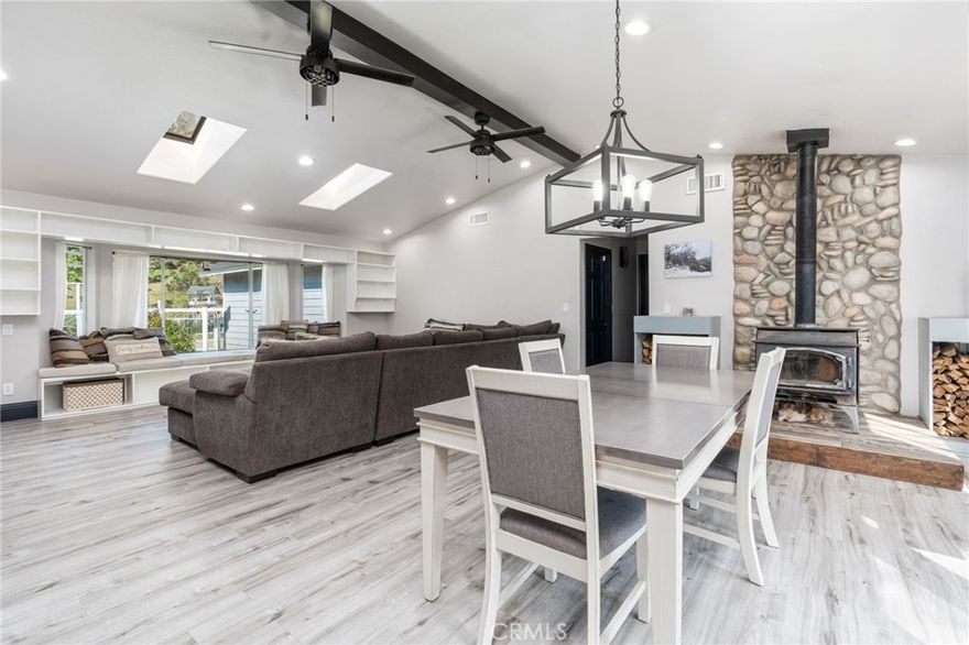 This private 5-bedroom, 4-bath home is nestled by a tranquil creek and includes a separate guest suite, offering privacy from the main bedrooms. The expansive primary suite provides a peaceful retreat, while the recently remodeled chef's kitchen features stunning quartz countertops, a spacious pantry, and updated flooring. The home is equipped with two HVAC systems for year-round comfort, two septic tanks, and a filtration system for the well. The fenced yard is perfect for gardens, children, or pets, and mature trees offer added privacy. Additionally, the property backs up to BLM land.