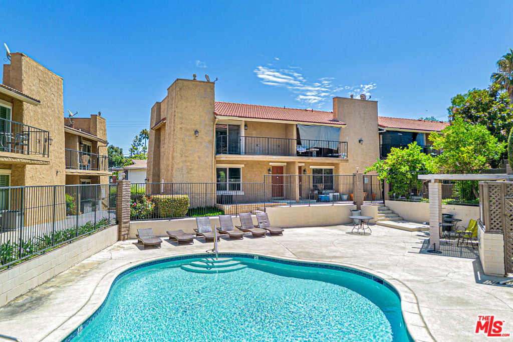 Immaculate Tri-Level End Unit Townhome in Prime Anaheim Location. This beautifully maintained end-unit townhome is located in a peaceful and private community with effortless access to the 91 and 55 freeways. Nestled in the heart of Anaheim, just 8 miles from Disneyland, this home is minutes from top-rated schools, local parks, shopping centers, and restaurantsoffering both comfort and convenience in one of Orange County's most desirable areas.Boasting approximately 1,218 square feet, this three-story residence features 3 spacious bedrooms and 2.5 bathrooms, along with a fully finished two-car attached garage and two additional assigned parking spaces in a private lot.Step inside to discover fresh designer paint, brand-new luxury vinyl plank flooring, soaring ceilings with recessed LED lighting, and large windows that fill the home with natural light. The main living area offers a warm and inviting space with a cozy fireplace and a formal dining area that flows seamlessly into the gourmet kitchen. The kitchen is beautifully upgraded with quartz countertops, custom cabinetry, and stainless steel appliancesperfect for entertaining or everyday living.All three bedrooms are located on the top floor, including the primary suite which features a private balcony with pool views, a full en-suite bathroom, and abundant closet space. An additional full bathroom and two well-sized bedrooms complete the upper level.Additional highlights include central air and heat, an indoor laundry room with washer and dryer, and a spacious outdoor deck off the living room that overlooks the sparkling community pool.El Palacio Condominiums offers a serene setting with well-kept landscaping, a resort-style pool, and a family-friendly atmosphere. This turnkey property is move-in ready and offers exceptional value and lifestyle.Don't miss this rare opportunity. This home won't last.