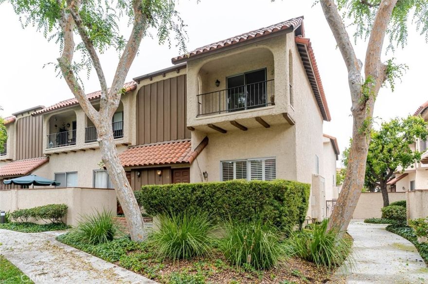 END UNIT TOWNHOME IN THE HEART OF RESEDA. UNIT FACES BEAUTIFUL GREEN LUSH COMPLEX AND WOW VIEW VIEW VIEW FROM PRIMARY BEDROOM. FRESH INTERIOR PAINT. CHOOSE YOUR OWN FLOORING AND MAKE IT YOUR OWN- Seller will consider providing credit towards flooring! Bright and spacious 3bed/2.5bath with high vaulted ceiling, a thoughtful, split-level floor plan with separate living and dining areas, and only one shared wall for added privacy. Enjoy the upcoming summer relaxing in your own private patio overlooking the beautiful green complex and pool. The large primary suite includes a generous walk-in closet, private bathroom, and spacious private balcony overlooking the beautiful lush greenbelt and community. Washer and dryer are conveniently located upstairs near the bedrooms. The attached 2-car garage provides direct access and additional storage. The community offers three sparkling swimming pools, a jacuzzi, and outdoor lounge areas, all surrounded by mature trees and beautifully landscaped paths that create a tranquil, park-like setting. The HOA covers water, trash, and insurance. Located within walking distance to restaurants, markets, public transportation, and more, this beautiful townhome delivers the ideal blend of space, location, and lifestyle in the heart of Reseda.