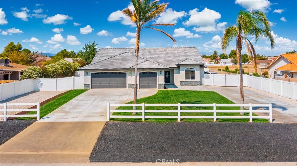 Modern Hesperia Home on Half an Acre with RV Parking! This beautifully updated 4 bedroom, 3 bathroom home offers modern style and comfort on a generous 0.5-acre lot. The open floor plan features a bright living area and a modern kitchen with a large island, abundant cabinetry, and plenty of counter space, perfect for cooking, entertaining, and family gatherings. The primary suite includes a private bath and contemporary finishes for your comfort. Throughout the home, you’ll find modern upgrades that create a fresh, move-in-ready feel. Enjoy the convenience of a 3 car garage and dedicated RV parking for all your toys. The expansive backyard is a blank canvas ready for your dream outdoor space whether that’s a pool, garden, or entertainment area. Located in a desirable Hesperia neighborhood with easy access to schools, shopping, and the freeway, this home combines modern living with ample space inside and out. Don’t miss it schedule your showing today!
