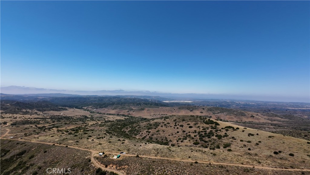 Don’t miss this rare opportunity to own a truly extraordinary piece of land in a highly desirable location! Situated a few miles from the charming, historic heart of San Juan Capistrano and moments from Ortega Highway, this expansive 600+ acre property spans four contiguous parcels and offers stunning ocean views from select vantage points. A standout feature of this offering is its valuable water rights sourced from the Cleveland National Forest, stemming from Caspers Wilderness Park—a unique and highly desirable asset for agricultural use, development planning, or private retreat design. Whether you're an investor, developer, builder, or seeking agricultural potential, this property presents endless possibilities. Zoned for one home per 5 acres, the land offers flexibility for a variety of uses—create a luxury estate compound, develop a collection of private residences, or establish an agricultural haven. With its unmatched combination of size, location, natural resources, and development potential, this is a once-in-a-generation opportunity to create something truly remarkable.
