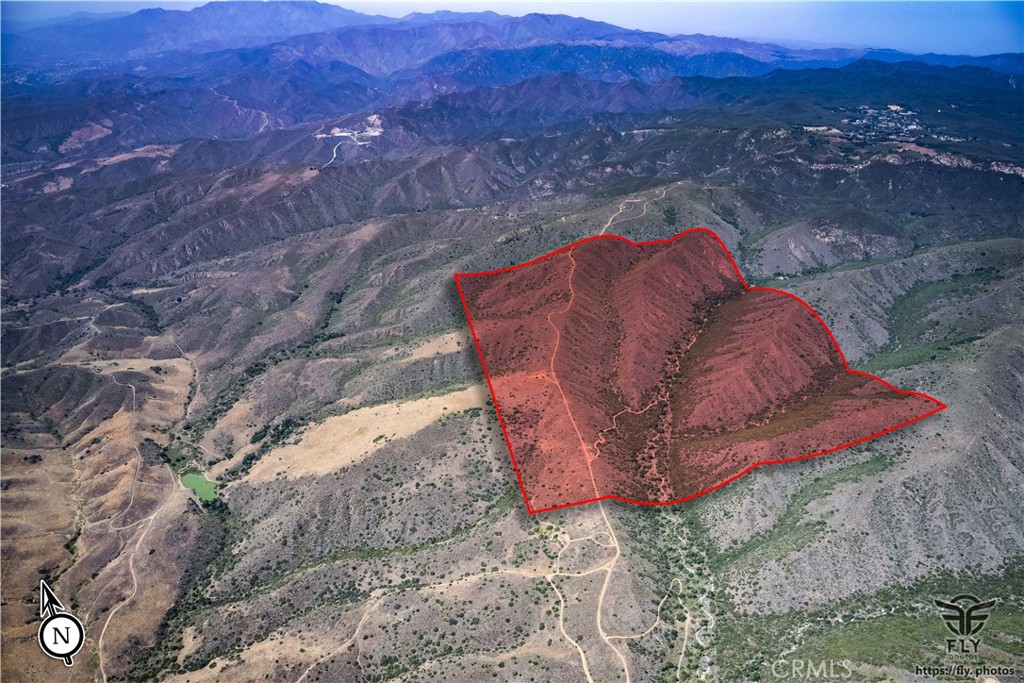 Don’t miss this rare opportunity to own a truly extraordinary piece of land. Situated on the Orange County boundary line adjacent to the Highly Desirable Rancho Mission Viejo Reserve and just a few miles from the charming, historic heart of San Juan Capistrano, moments from Ortega Highway, this expansive 600+ acre property spans four contiguous parcels and offers stunning ocean views from select vantage points. A standout feature of this offering is its valuable water rights sourced from the Cleveland National Forest, stemming from Caspers Wilderness Park—a unique and highly desirable asset for agricultural use, development planning, or private retreat design. Whether you're an investor, developer, builder, or seeking agricultural potential, this property presents endless possibilities. Zoned for one home per 5 acres, the land offers flexibility for a variety of uses—create a luxury estate compound, develop a collection of private residences, or establish an agricultural haven. With its unmatched combination of size, location, natural resources, and development potential, this is a once-in-a-generation opportunity to create something truly remarkable.