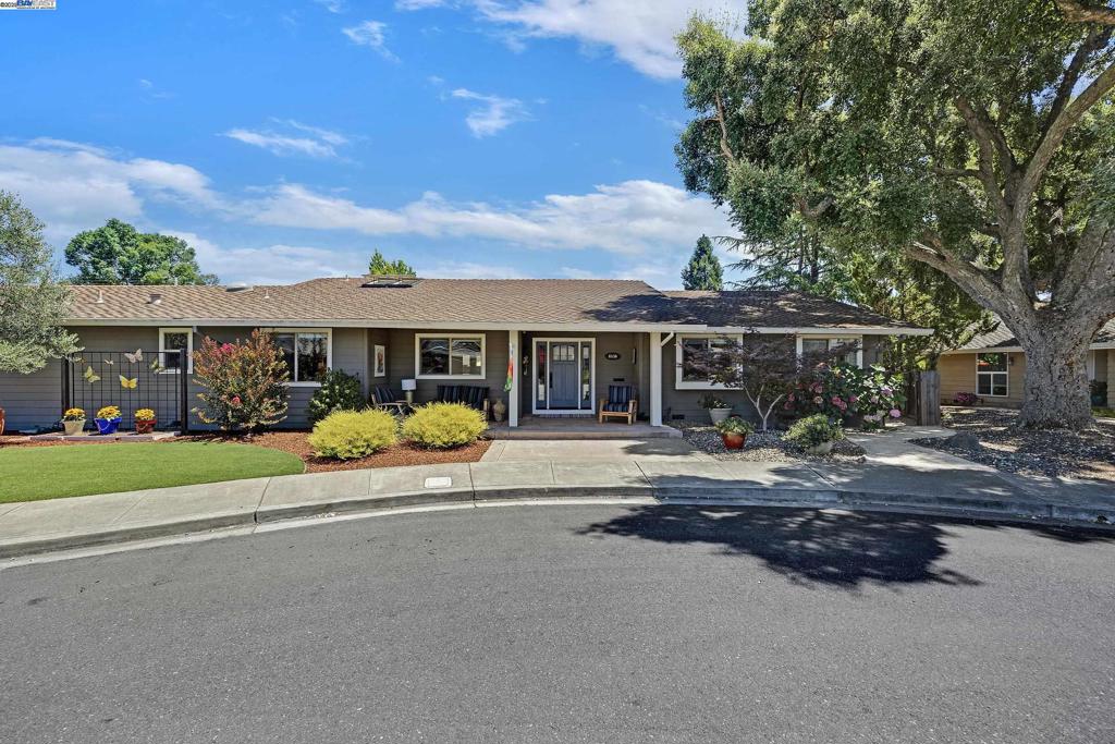 Redesigned with heart in 2005, this beautifully updated single-story home sits on a quiet court on nearly a ¼-acre flat lot, offering the perfect blend of comfort, functionality, and thoughtful upgrades. The open-concept layout features vaulted ceilings, exposed beams, a cozy wood-burning fireplace, and custom built-ins—showcasing pride of ownership throughout. With four bedrooms and three full bathrooms, the layout is ideal for multi-generational living: three bedrooms and two baths on one side, including a primary suite with a walk-in shower and a third bedroom currently used as an office. A private fourth bedroom with its own full bath and direct access to a secluded patio is tucked away on the opposite side of the home for added privacy. Notable upgrades include central vacuum, a whole-house water filtration system, and owned solar for long-term energy savings. The spacious backyard is designed for entertaining with a relaxing spa, room to expand, and ample space for RV parking. There’s also potential for an ADU, pending city approval. With easy access to 680, this home offers comfort, convenience, and flexibility—all in one exceptional package. Showings by appointment only. Thank you.