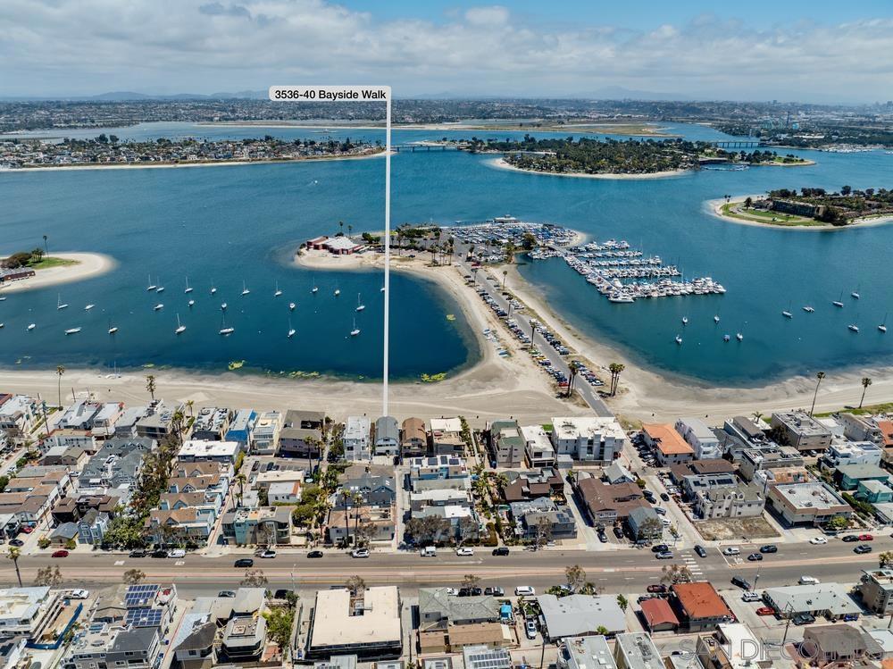 Rare Bayfront Triplex directly on the sandy shores of Mission Bay—an exceptional opportunity to live in one unit and rent the other two, or build your dream Bayfront estate. Enjoy breathtaking sunrise views, peaceful walks along the bay, and quick access to the surf across the street. At night, take in SeaWorld’s fireworks from the two lower patios or upper balcony. Ideally located near Mission Bay Yacht Club, Aquatic Center, Belmont Park, and all Mission Beach attractions. All three units are currently operating as short-term rentals (approx. $325K gross annual income, $50K expenses) with tenant occupancy and full interior remodels completed in 2022. New STR permit process, permits do not transfer. The 4,480 sq ft building, built in 1970, is in good condition with parking, newer roof (less than 10 yrs old), and new water heater. Recent upgrades include: new dishwasher and BBQ in unit 3540, freshly painted interior and exterior with excess wiring removed, all furniture and carpets replaced in all three units, new mattresses and pillows throughout, repaired cabinets, most light fixtures replaced, updated shower valves, new faucets, five new TVs, routers, inspected washer/dryer, repaired Medeco locks, new patio set (3536), exterior lighting (3534/3536), new smoke detectors, fire extinguishers, and updated electrical outlets.