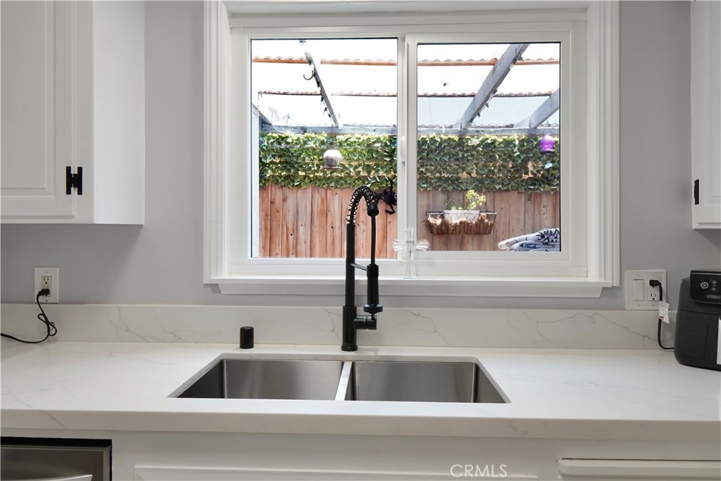 Located within the highly sought-after Troy High School boundaries, this beautifully renovated, gated home offers a true tropical retreat, surrounded by lush, mature landscaping that creates a private and peaceful setting.
Step inside this fully upgraded two-story unit—attached, with no neighbors above or below—and enjoy high-end finishes throughout, along with a charming urban garden that brings vibrant greenery right to your doorstep. The thoughtfully designed layout features ample storage both inside and in the garage, private laundry, and tasteful modern touches in every room.
The main bathroom feels like a spa escape, featuring a deep soaking tub enclosed in glass, a dual vanity, and stunning designer finishes.
Residents also enjoy resort-style community amenities, including a sparkling pool and a clean, well-maintained clubhouse—ideal for weekend relaxation or entertaining.
Perfectly situated with convenient freeway access, this home is just minutes from award-winning schools, world-class dining, premier shopping, and top-tier entertainment.
313 N. Acacia isn’t just a home—it’s a private oasis in the heart of it all. Come experience the lifestyle for yourself.